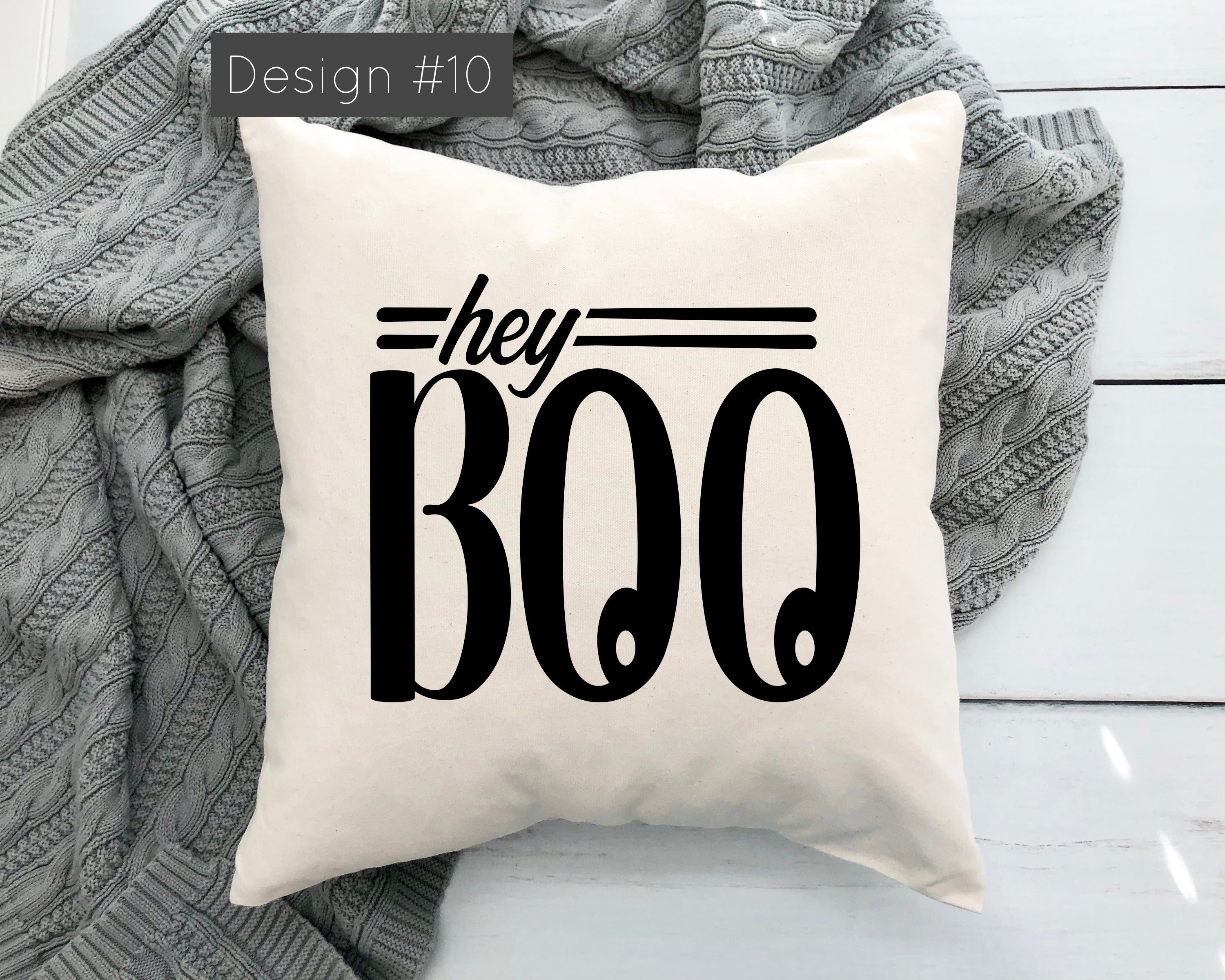 Pillow with 'hey BOO' text on a white background