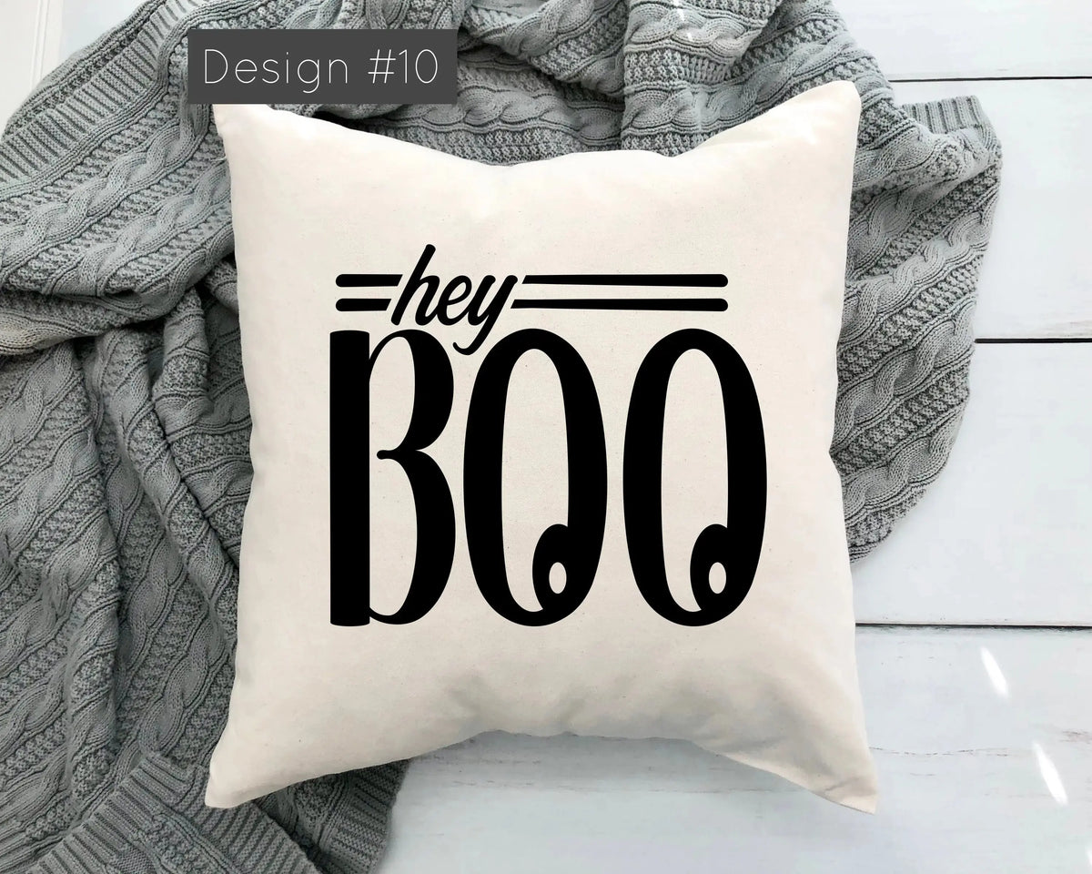Pillow with 'hey BOO' text on a white background