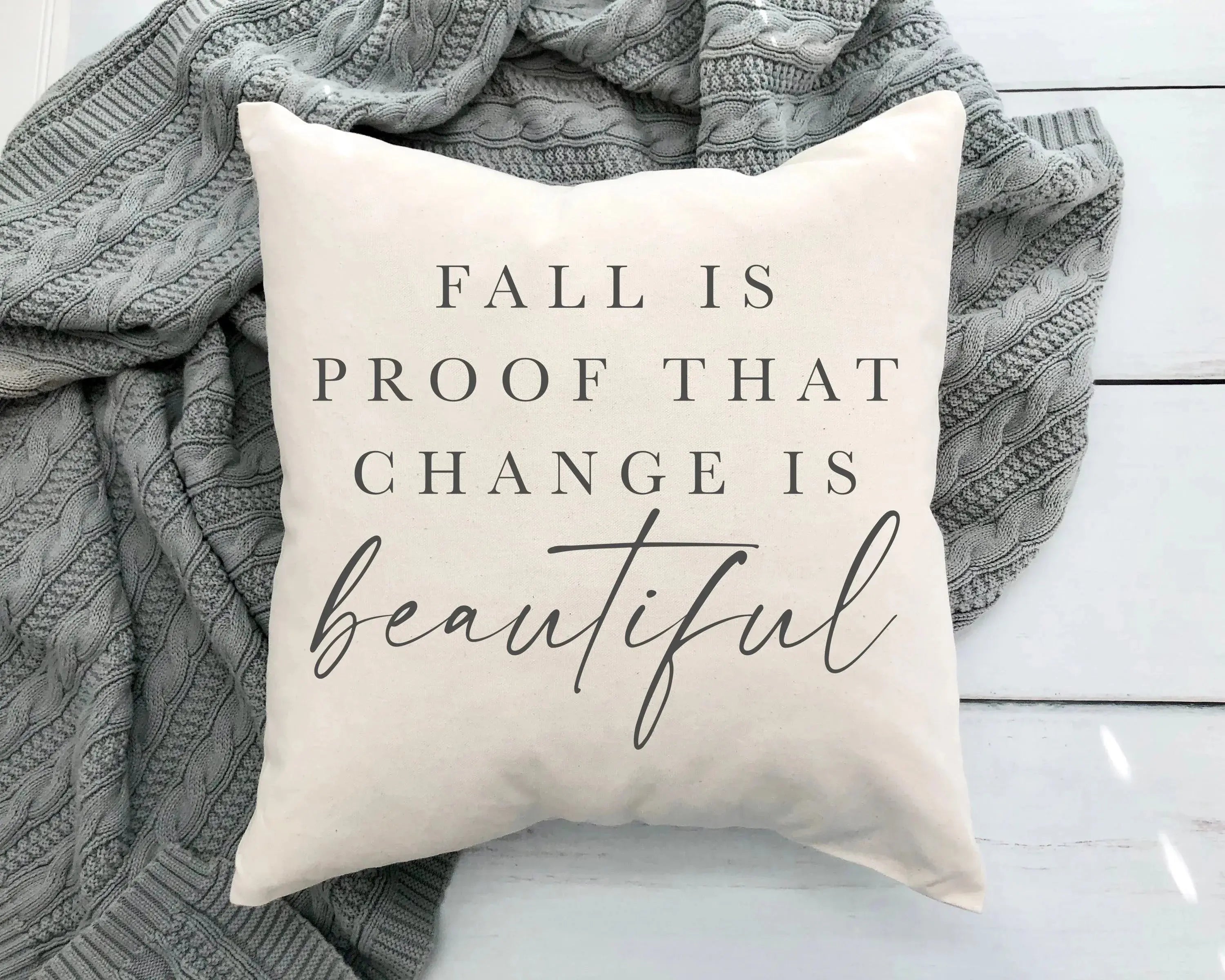 Fall is proof that change is beautiful pillow with cozy gray knit blanket, farmhouse decor