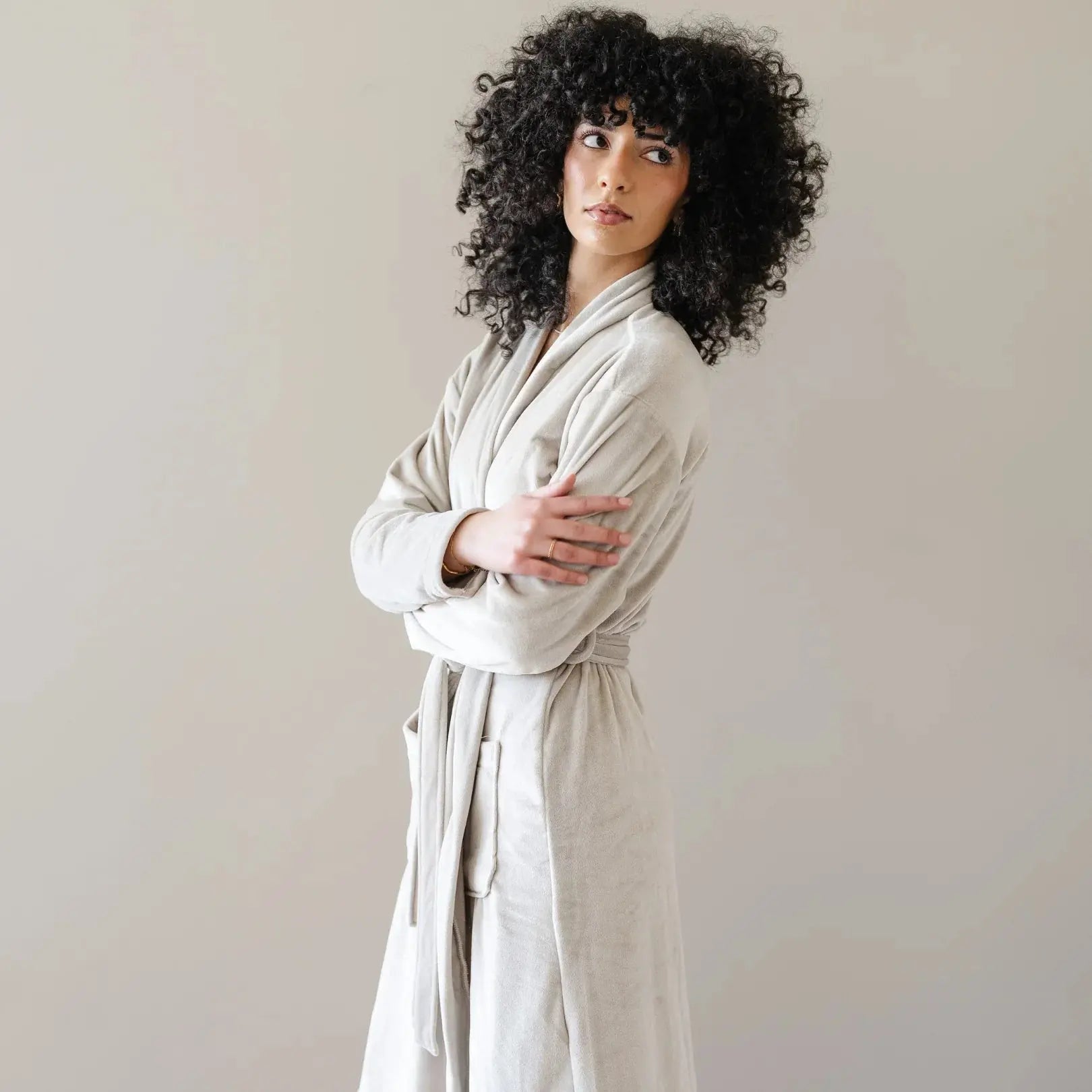 Cozy beige bathrobe for women, soft plush robe with belt, perfect for farmhouse or cottage style home spa relaxation