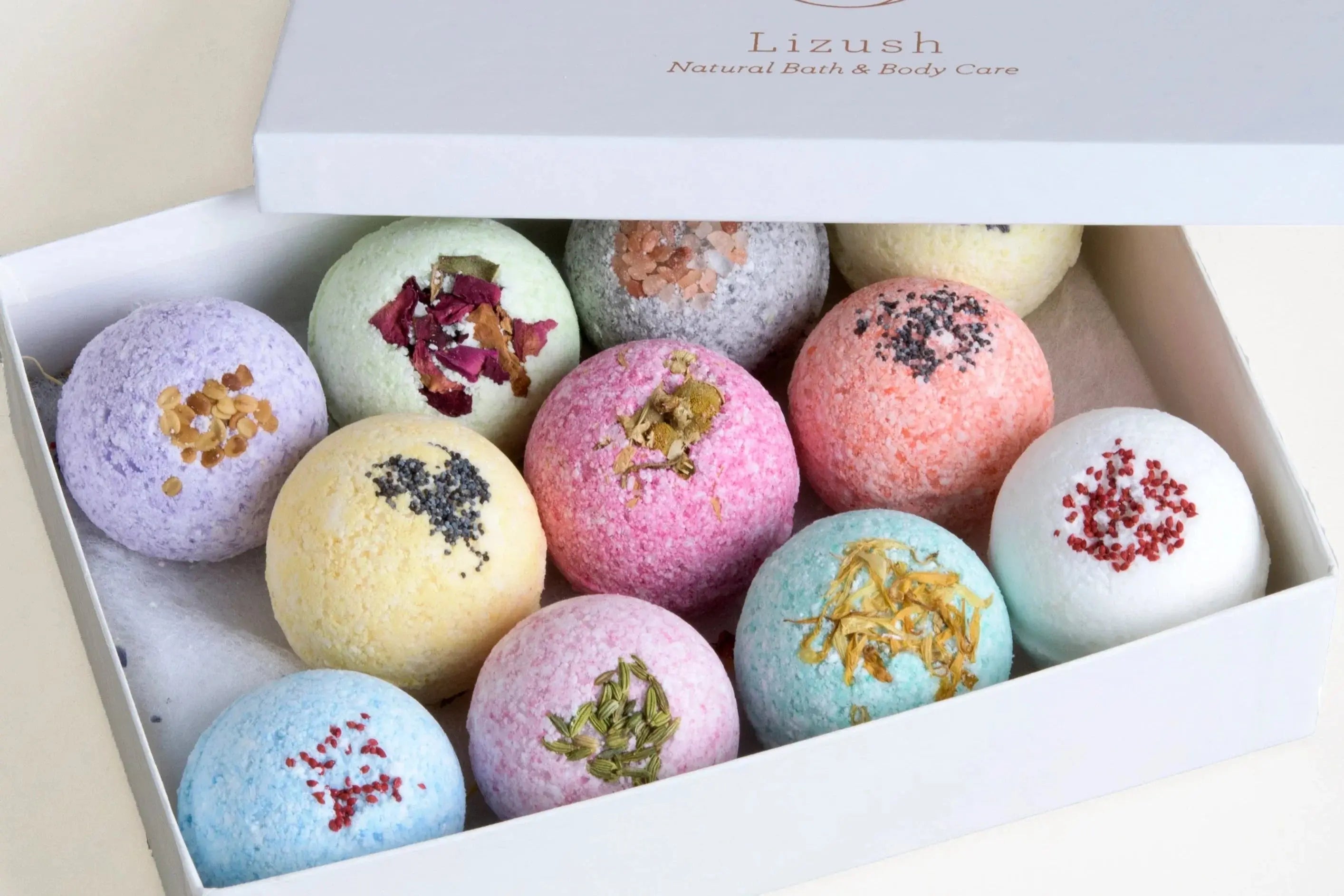 Colorful bath bombs with dried flowers in a gift box, natural bath & body care