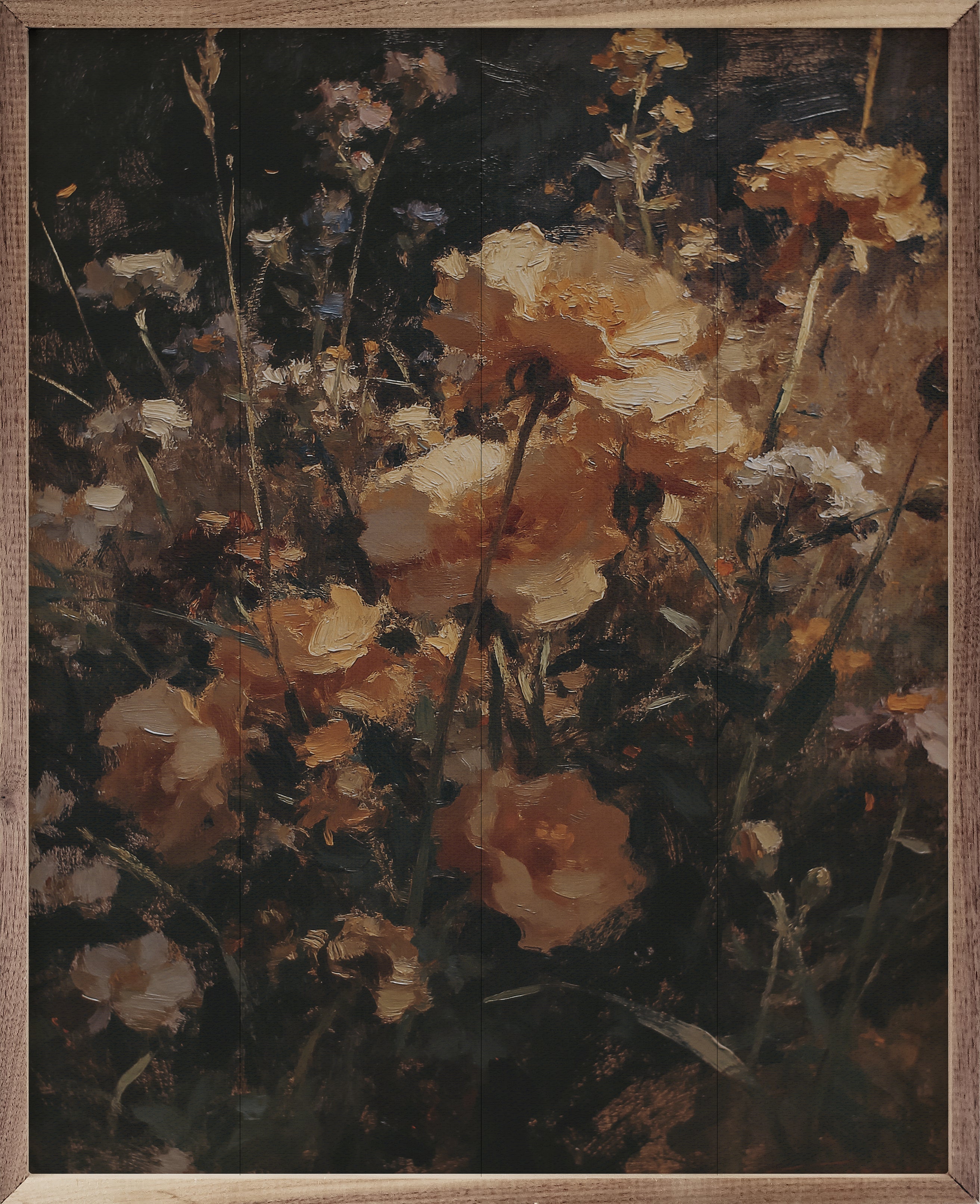 Framed artwork of a floral arrangement with warm tones.