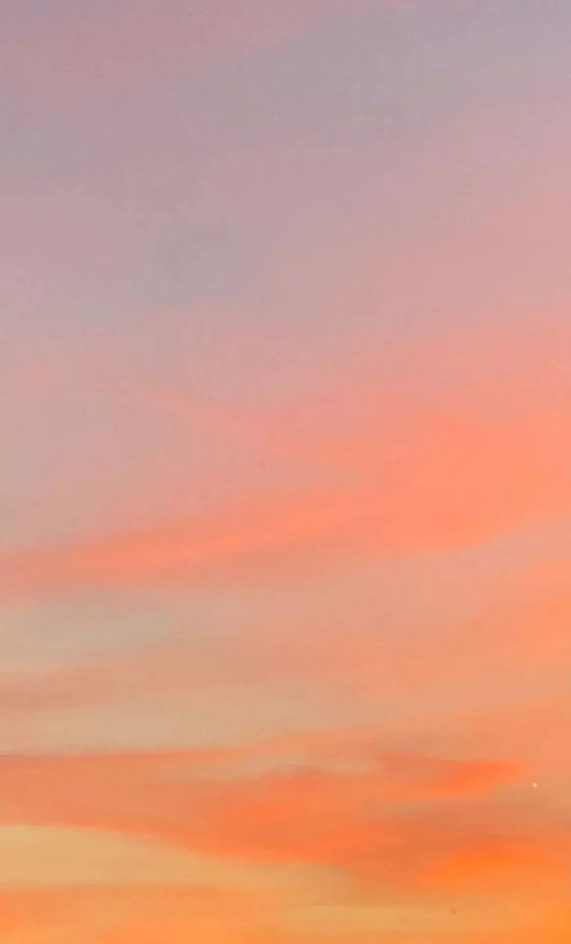 Soft pastel sunset sky with pink, orange, and lavender hues for cozy home decor inspiration