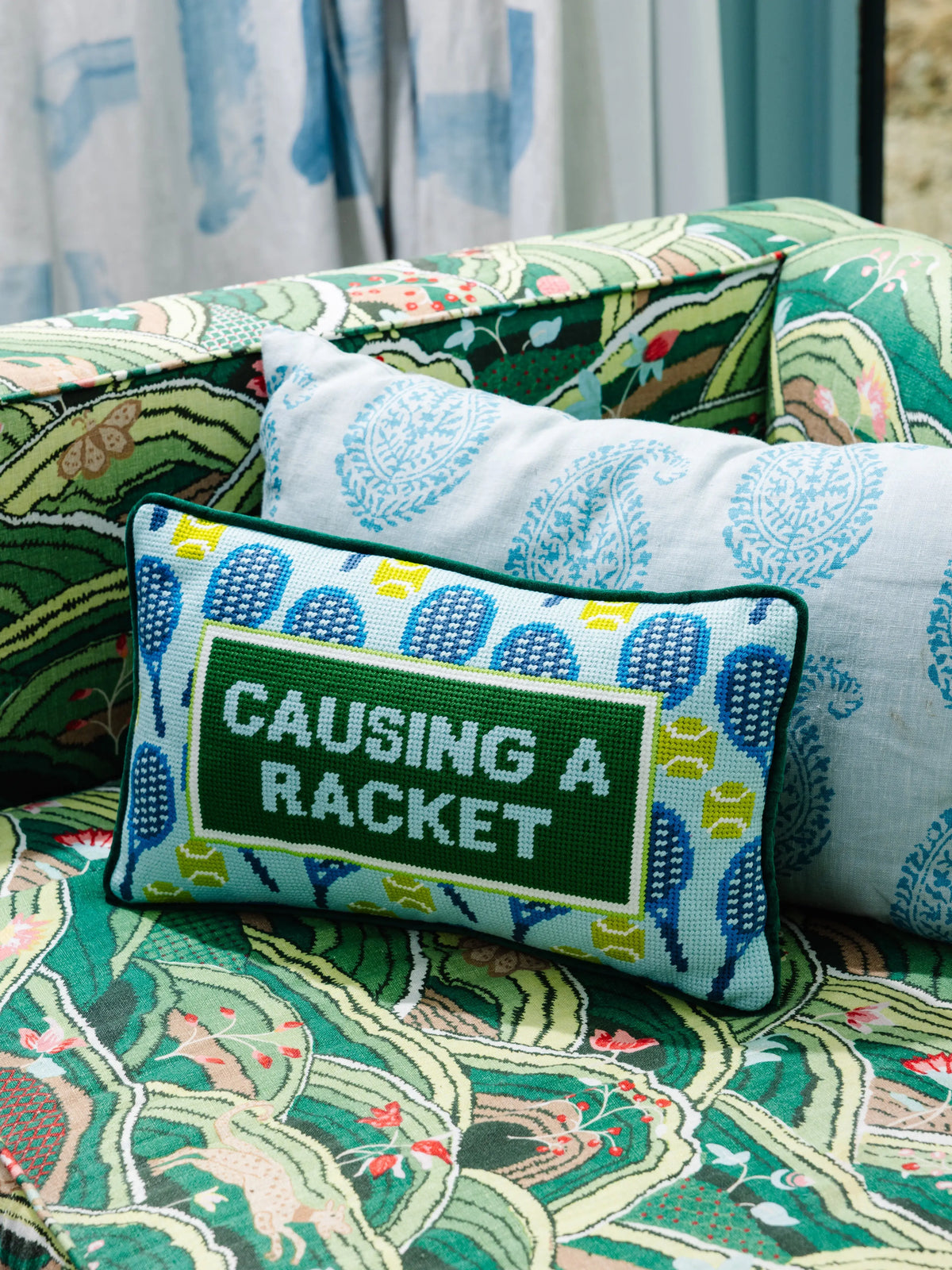 Causing A Racket Needlepoint Pillow