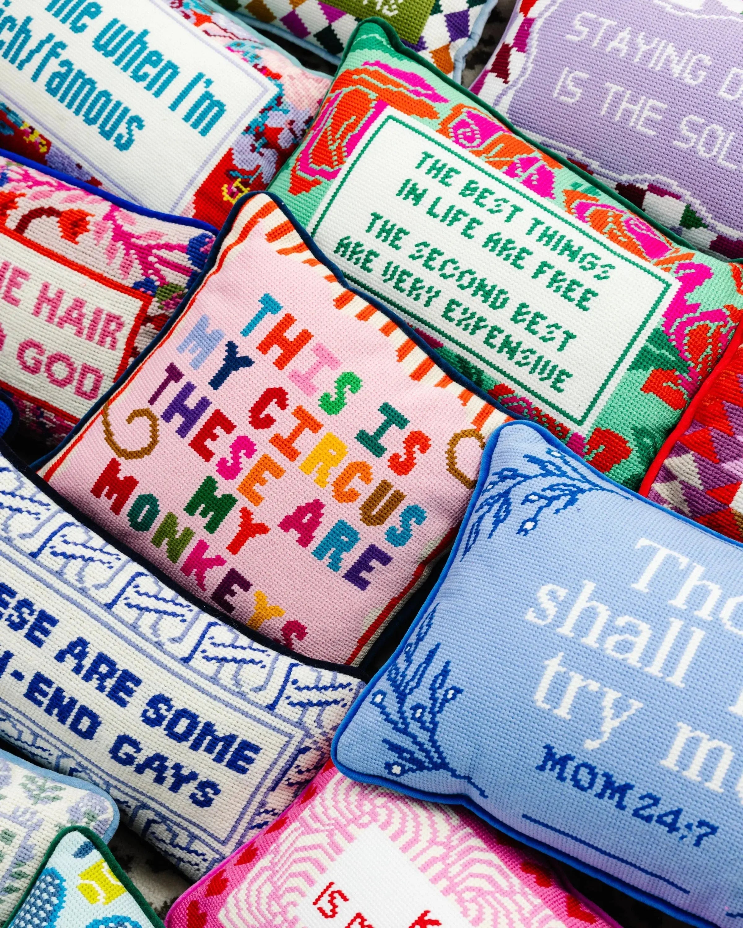 Colorful embroidered throw pillows with funny quotes, perfect for cozy farmhouse or cottage style home decor.