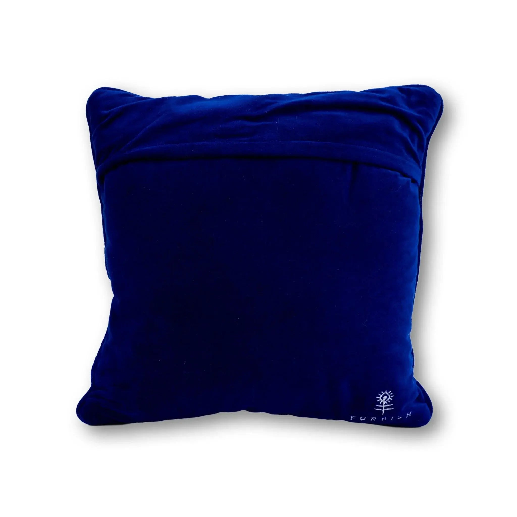 Deep blue velvet throw pillow with subtle embroidered logo, perfect for cozy farmhouse decor