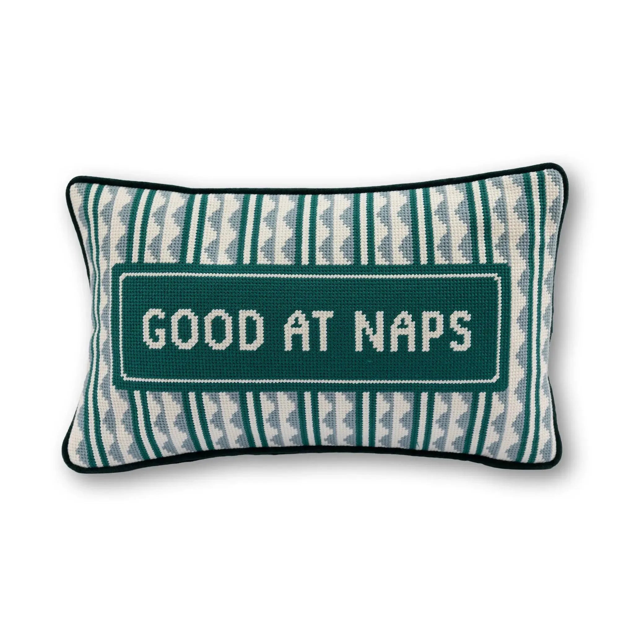 Decorative pillow with 'Good at Naps' text on a white background