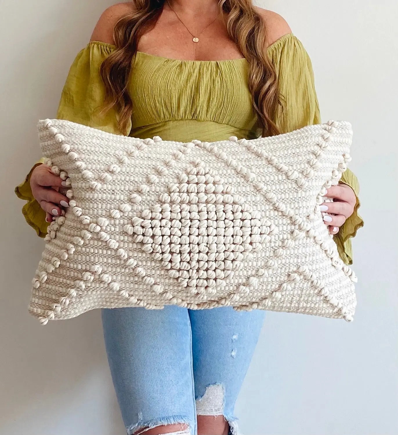 Cream textured throw pillow with bobble weave, cozy farmhouse decor accent for living room or bedroom