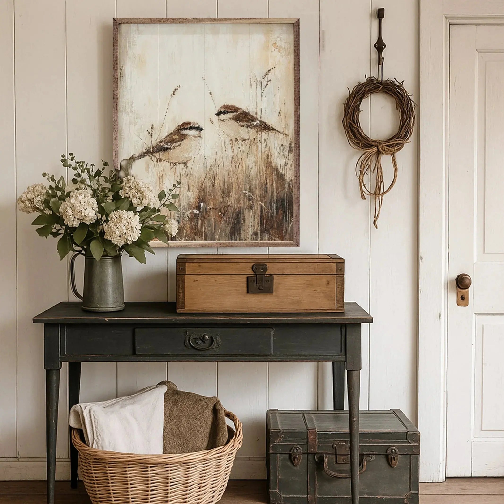 Cozy farmhouse entryway with bird wall art, rustic console table, wicker basket, and vintage trunk decor