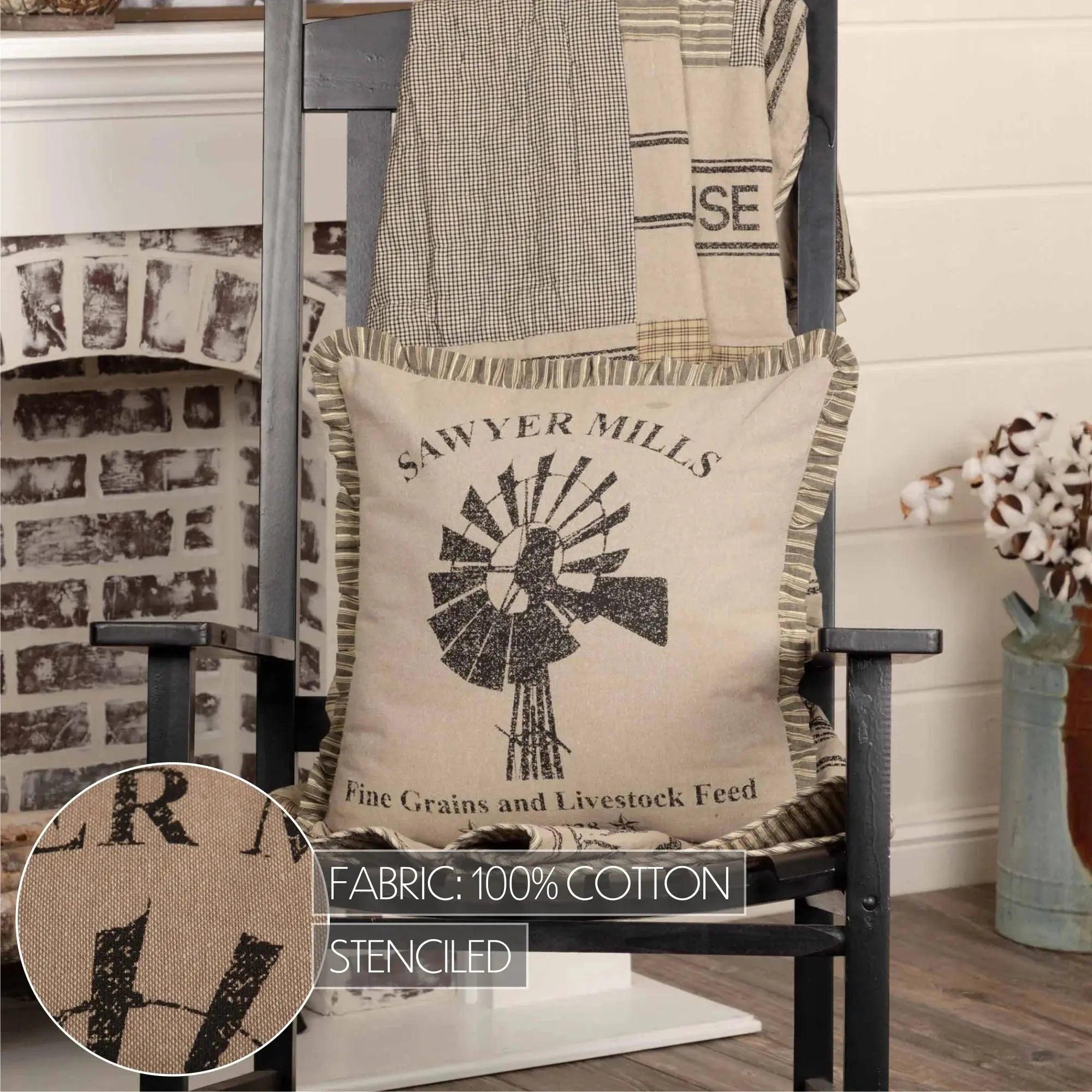 Farmhouse pillow with windmill design, 'Sawyer Mills' text, 100% cotton, stenciled, on rustic chair
