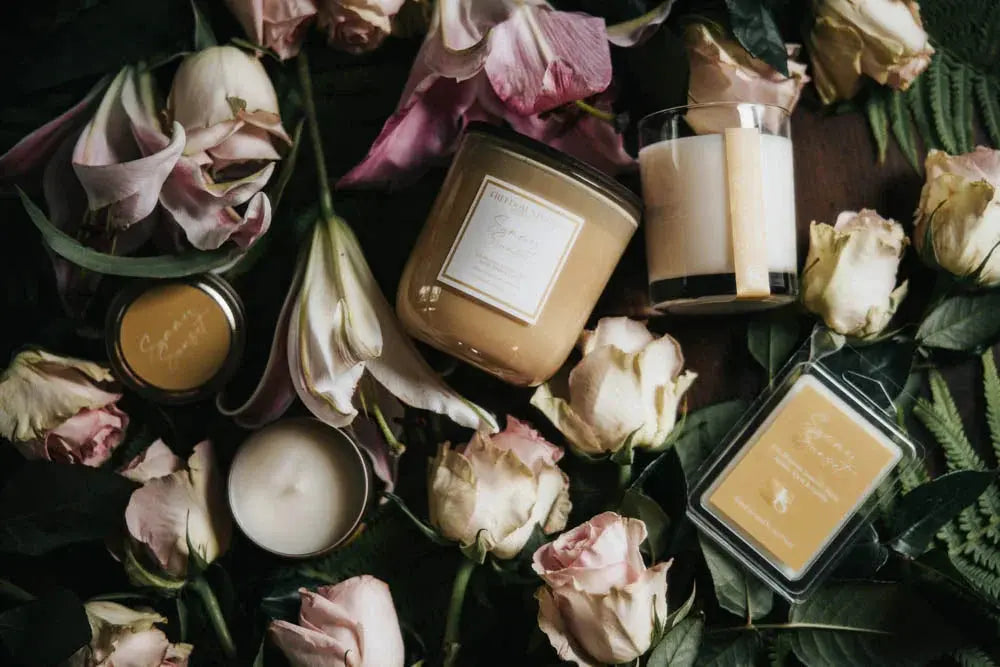 Cozy farmhouse candle set with dried roses and greenery, perfect for cottage-style home decor and relaxation.