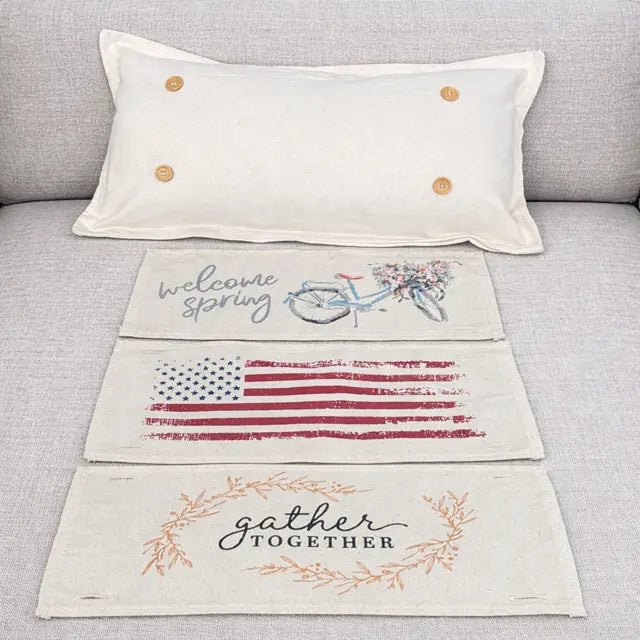 Decorative pillow with 'welcome spring' and 'gather together' text on a gray couch.