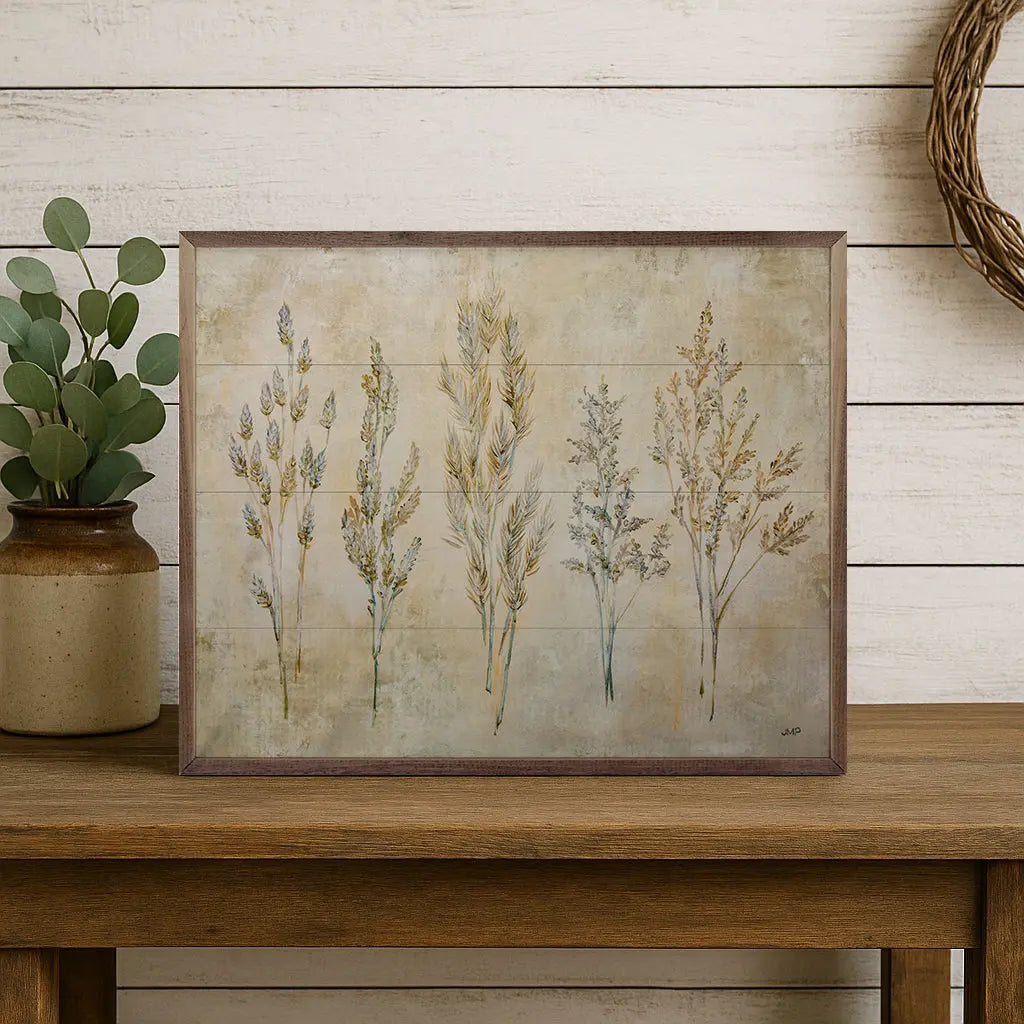 Framed botanical artwork on a wooden surface with a rustic background