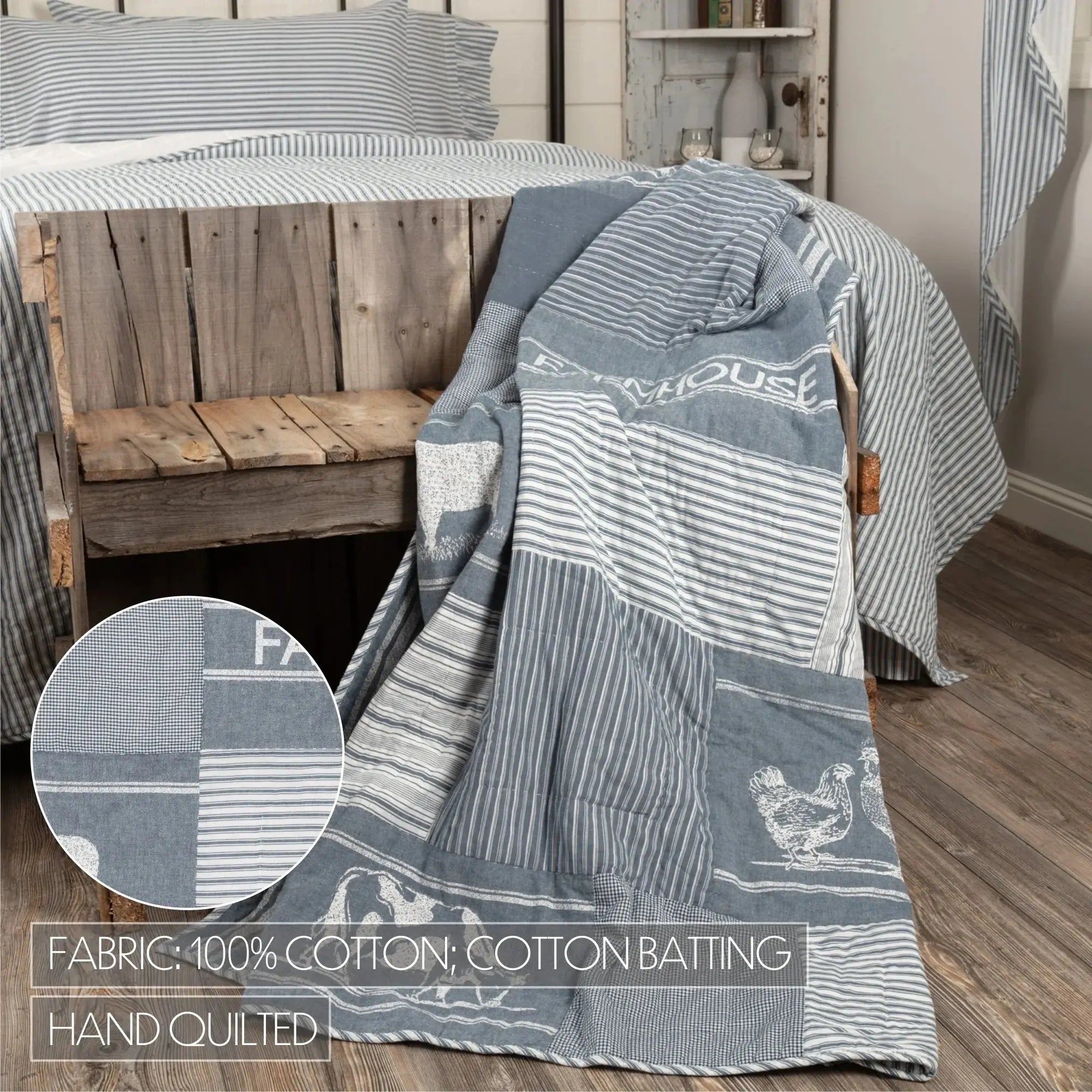 Blue and white patterned quilt draped over a wooden bench with a close-up of fabric texture.