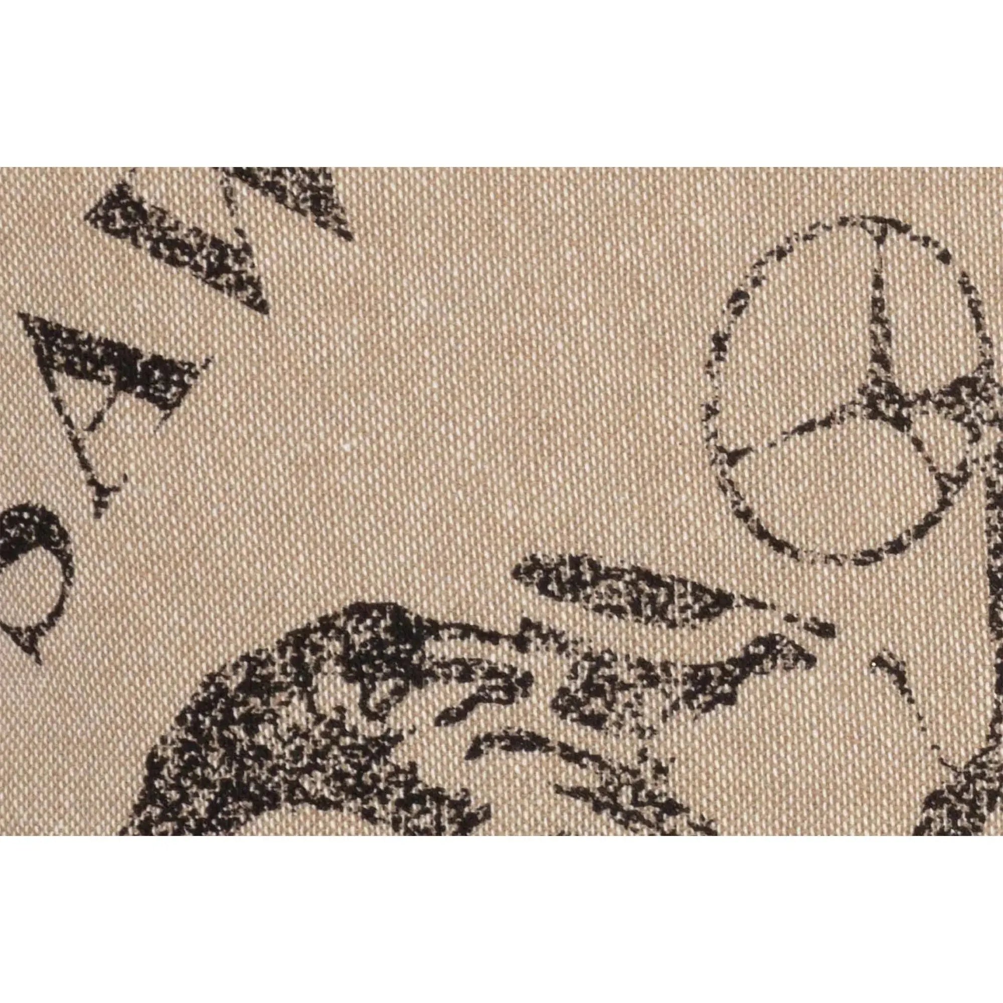Textured fabric with black abstract designs on a beige background