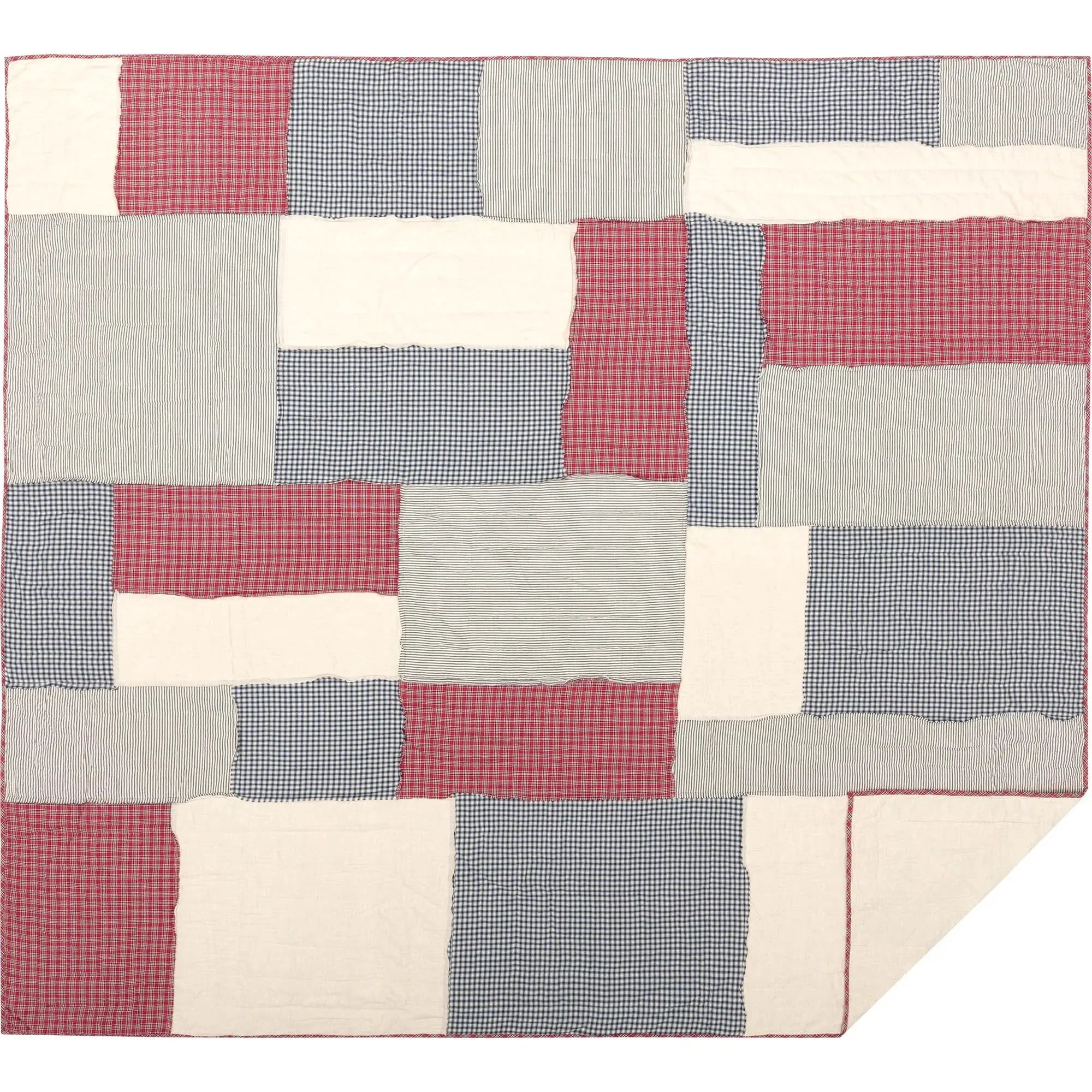 Red, blue, and cream patchwork quilt with gingham and striped blocks, cozy farmhouse decor