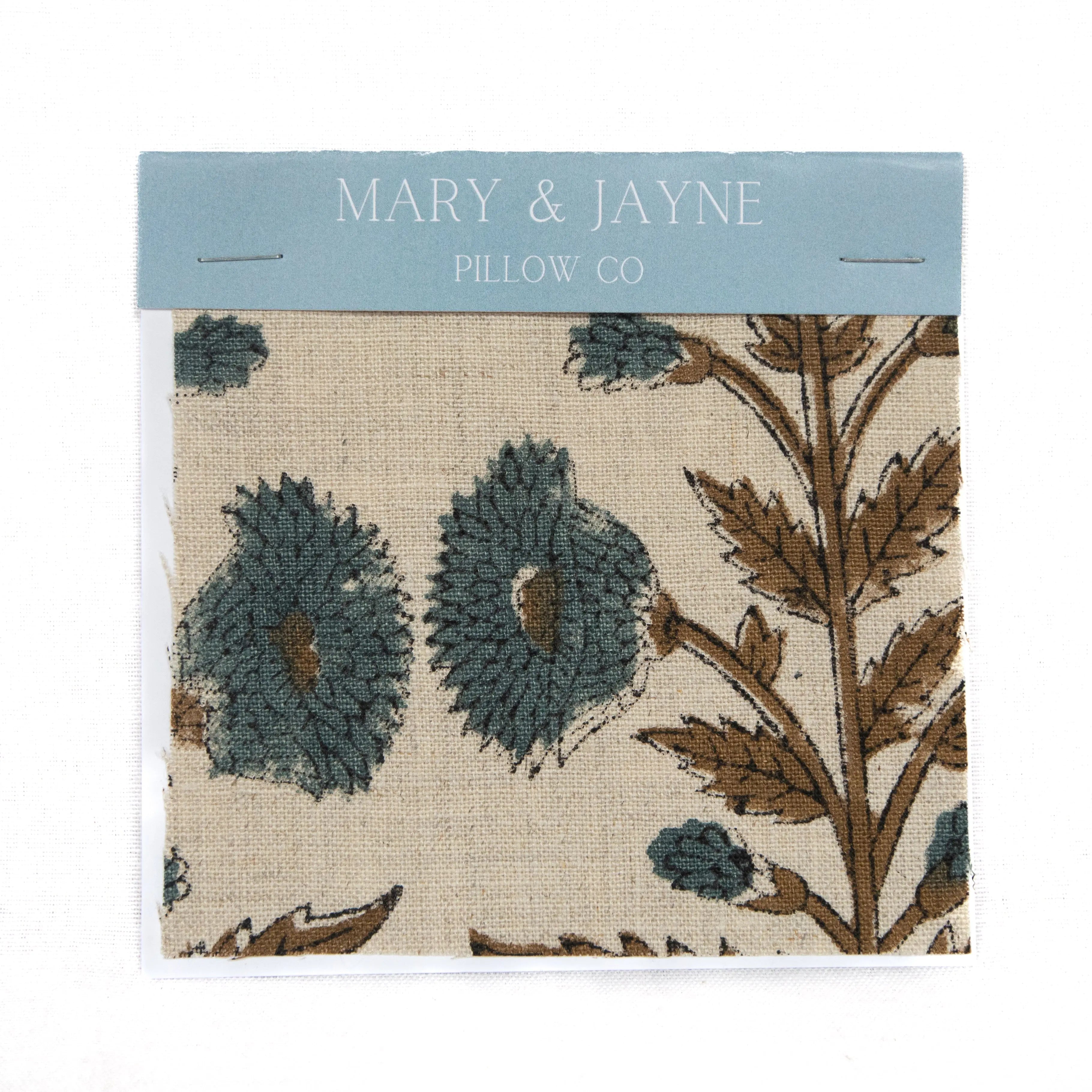 Floral patterned fabric with 'Mary & Jayne Pillow Co' branding on a white background