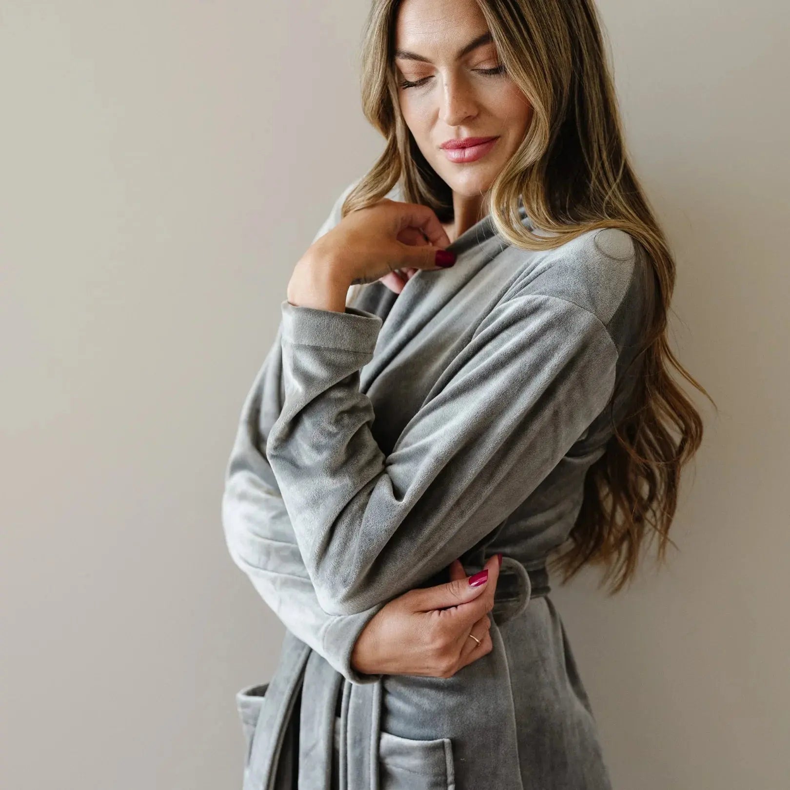 Woman in cozy gray velour robe, perfect for farmhouse or cottage style bath and relaxation