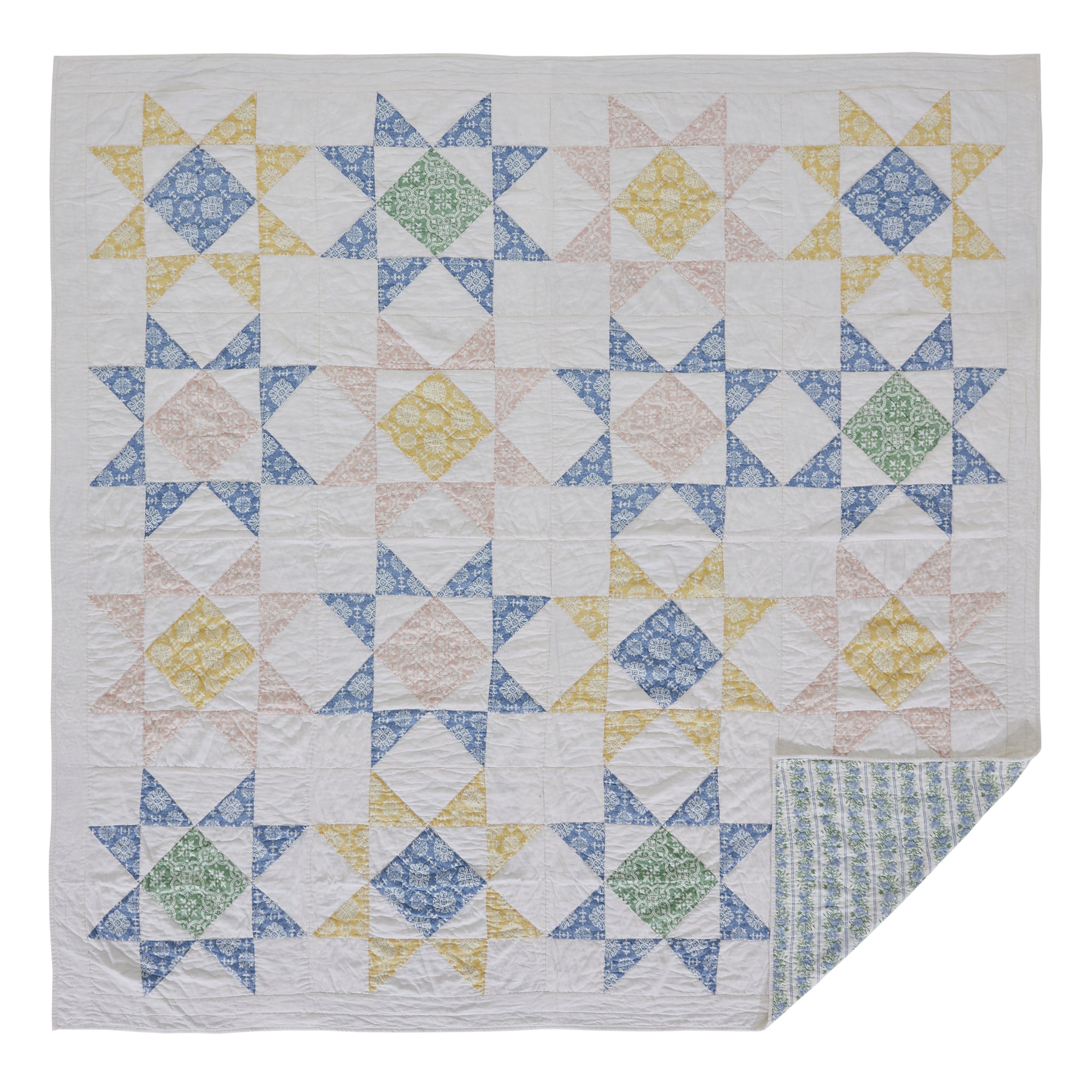 Quilt with geometric pattern on a white background