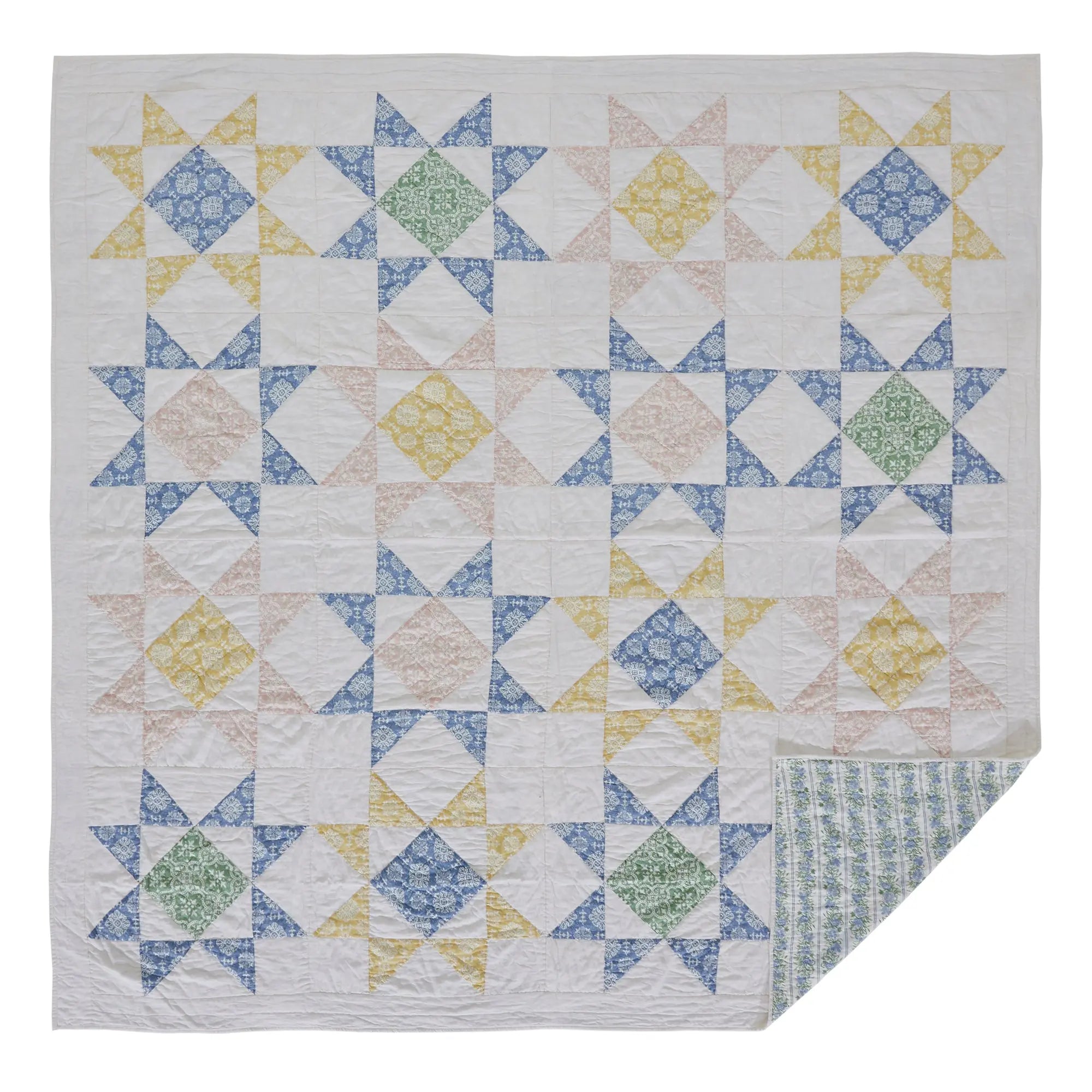 Quilt with geometric pattern on a white background
