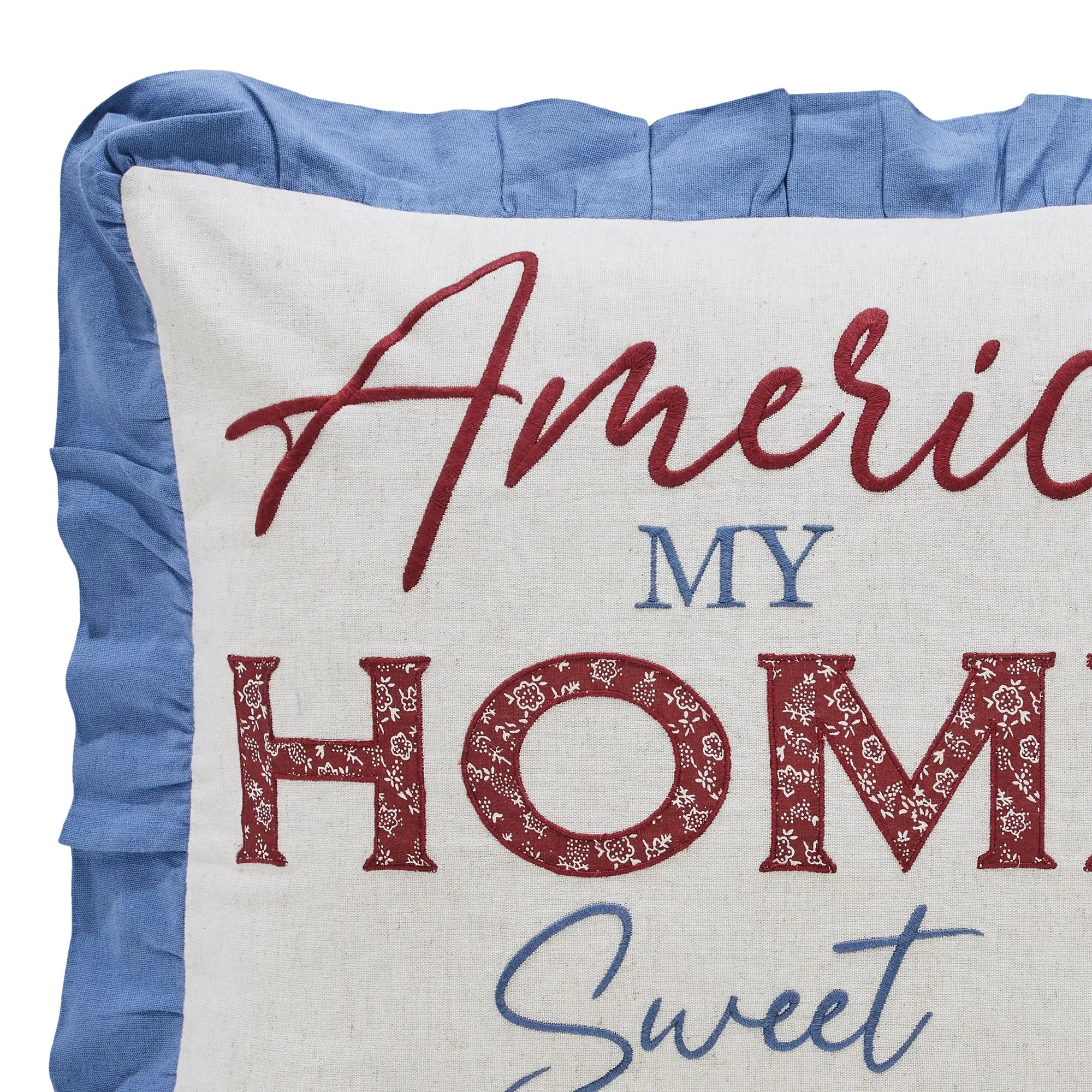 Decorative pillow with 'America My Home Sweet' text on a blue background