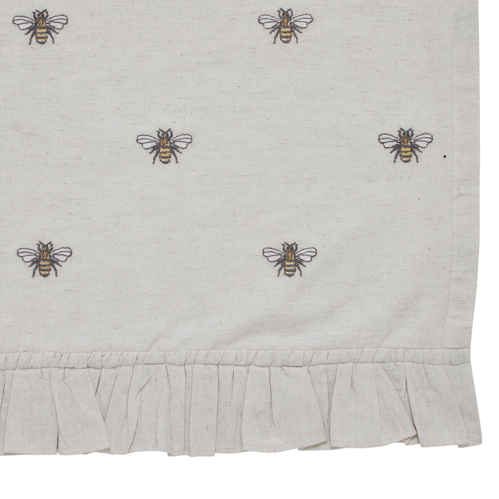 Bees embroidered on farmhouse-style kitchen towel with ruffled hem, cozy cottage decor