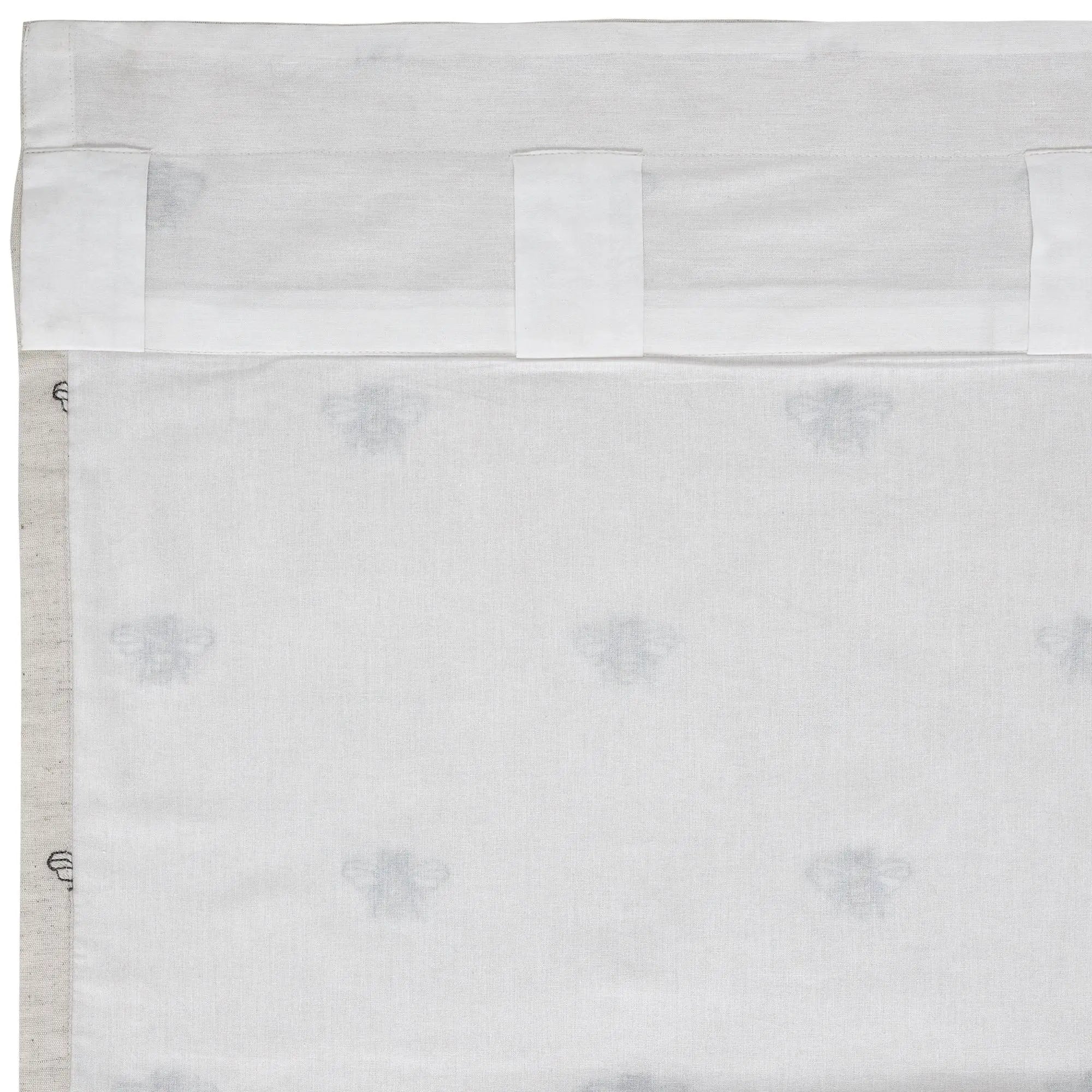 White farmhouse curtain with subtle bee print and tab top design for cozy cottage style windows