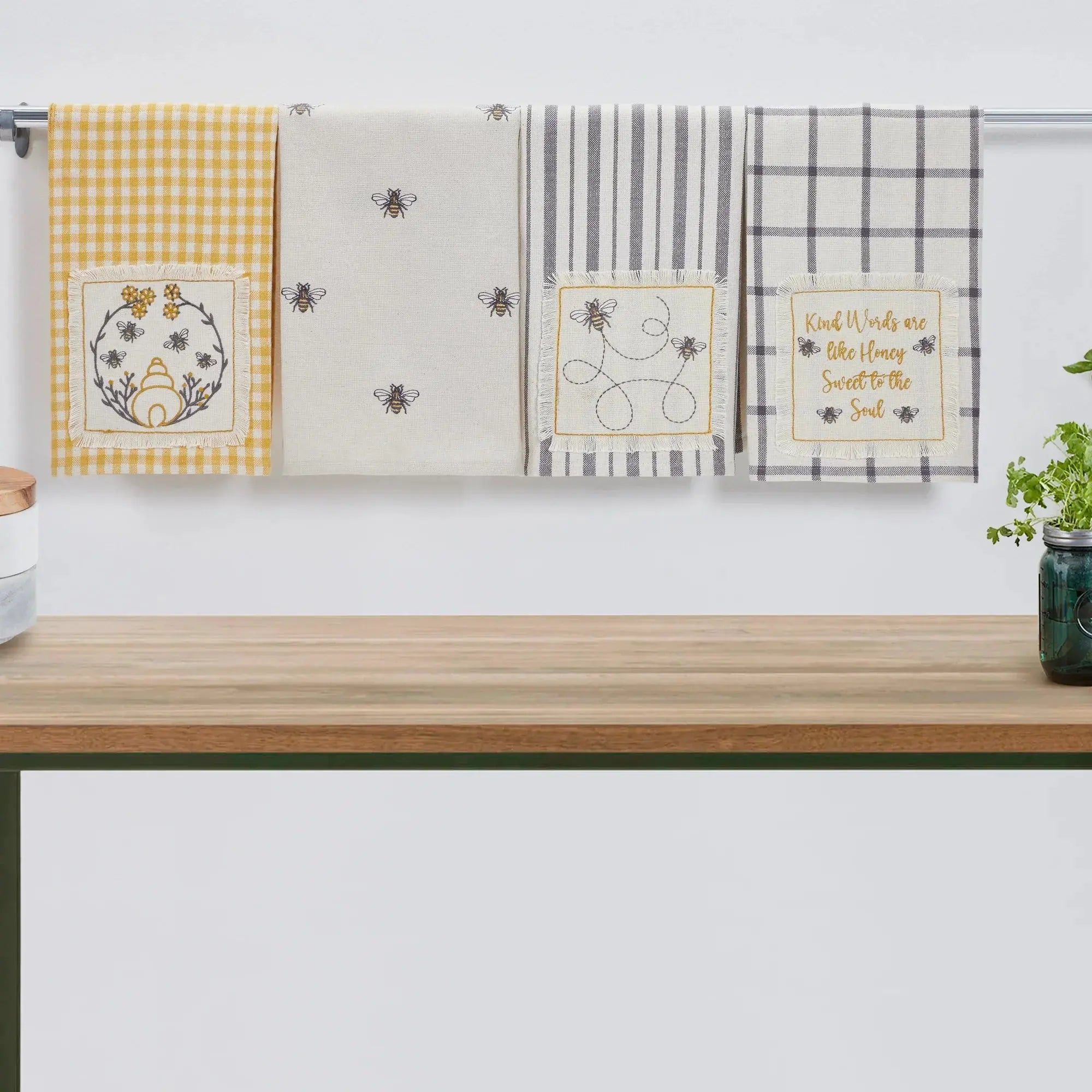 Cozy farmhouse kitchen towels with bee designs, gingham, stripes, and inspirational quotes for home decor