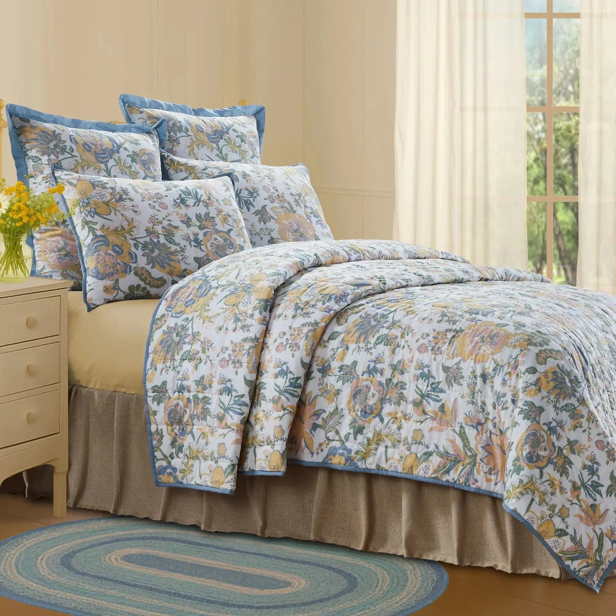 Floral quilt set with blue trim, cozy farmhouse bedroom decor, soft bedding for peaceful living spaces