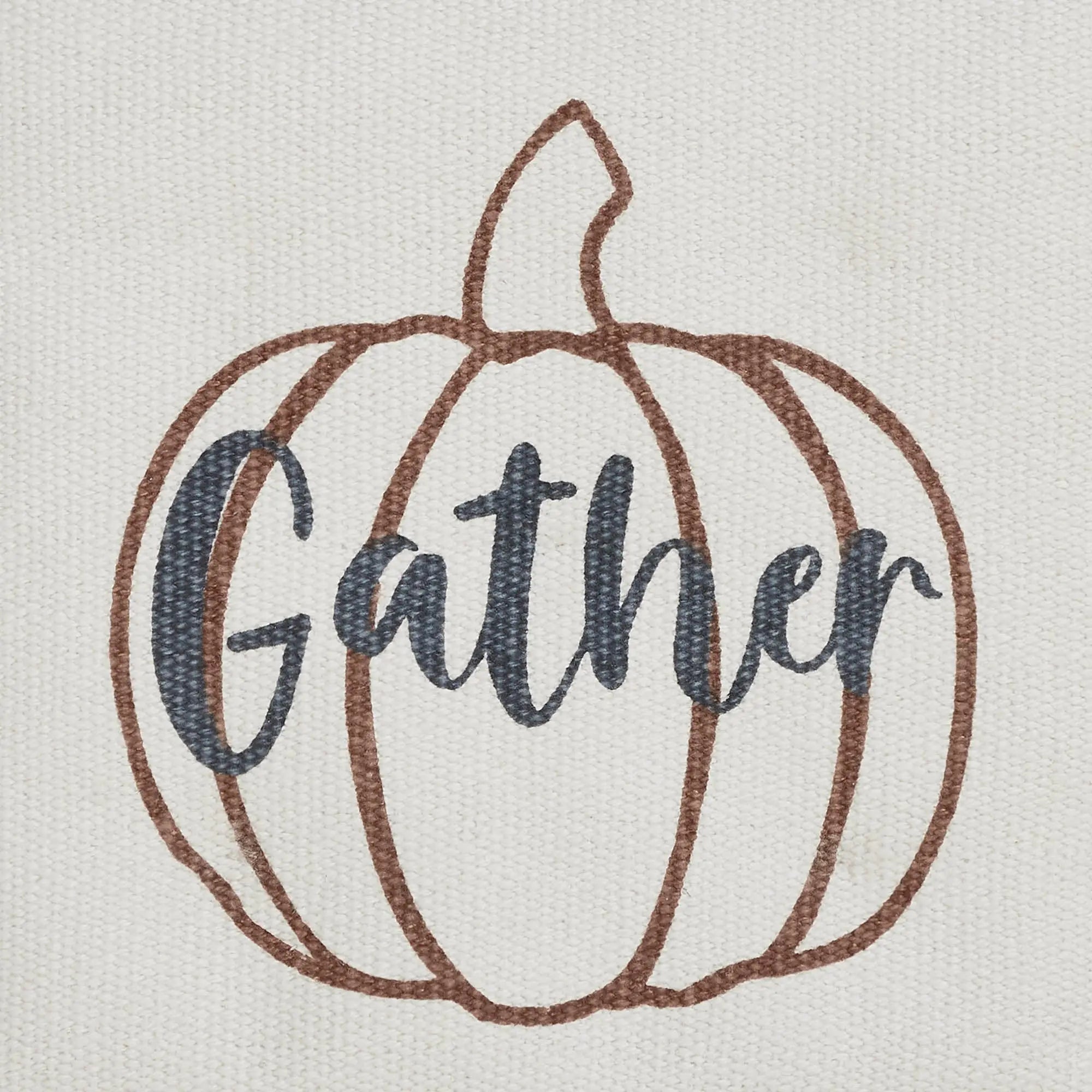 Embroidered pumpkin design with the word 'Gather' on a fabric background