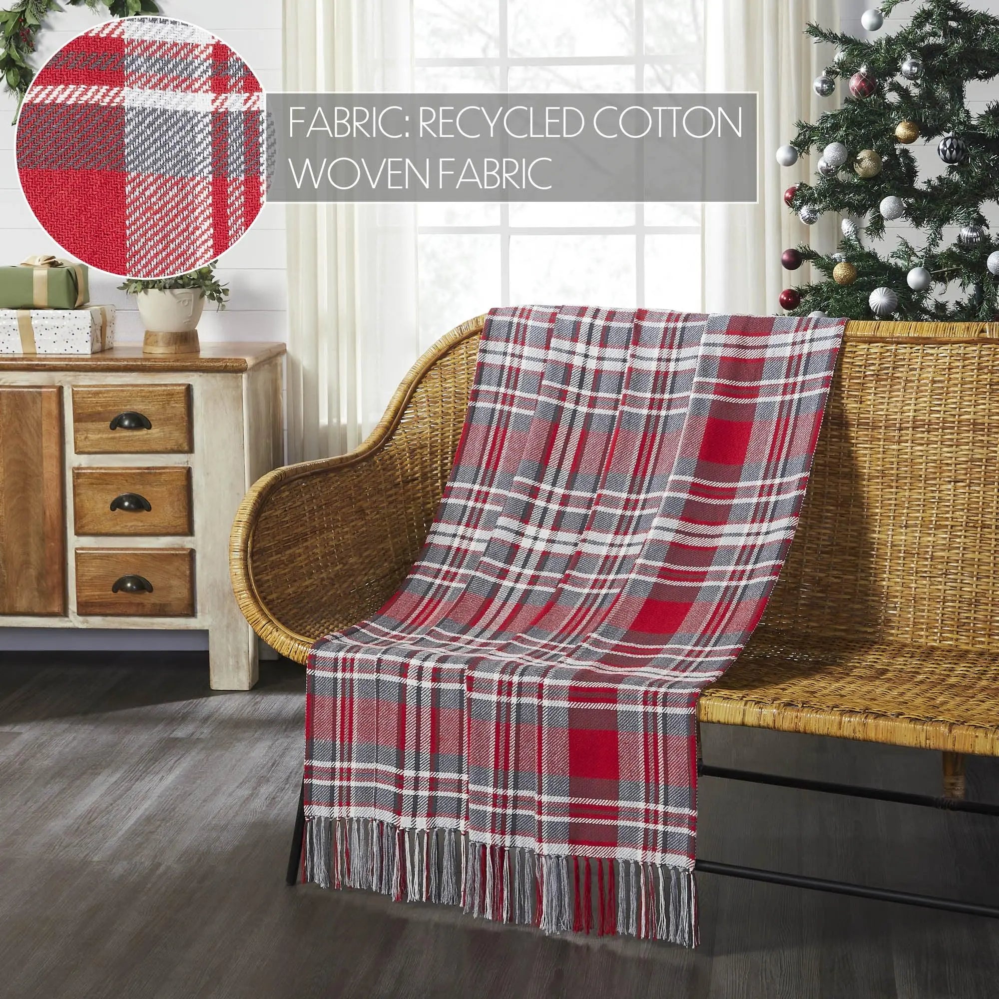 Red and gray plaid throw blanket on wicker chair, cozy farmhouse decor with Christmas tree