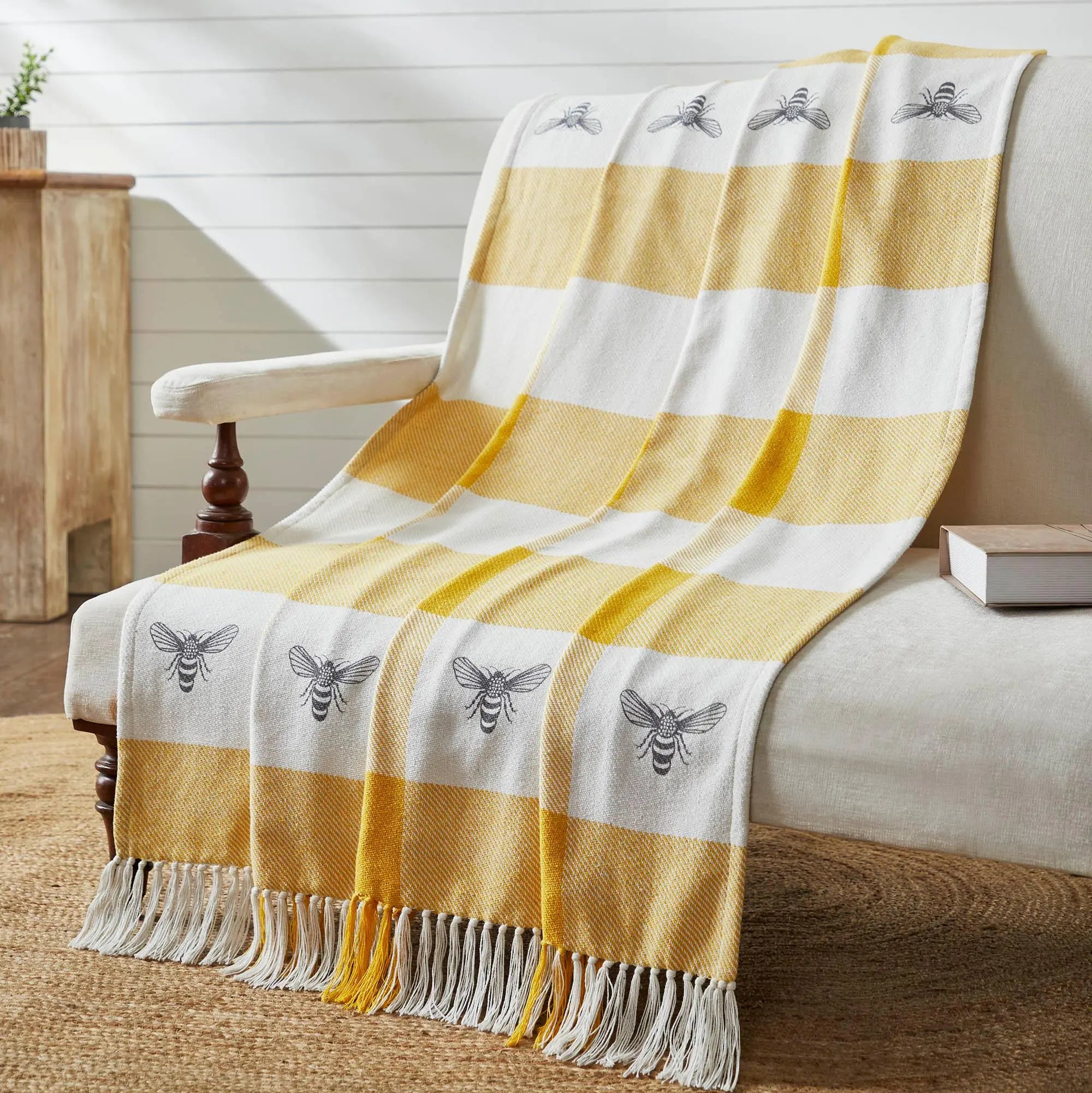Yellow and white striped throw blanket with bee print, farmhouse decor, cozy living room accent