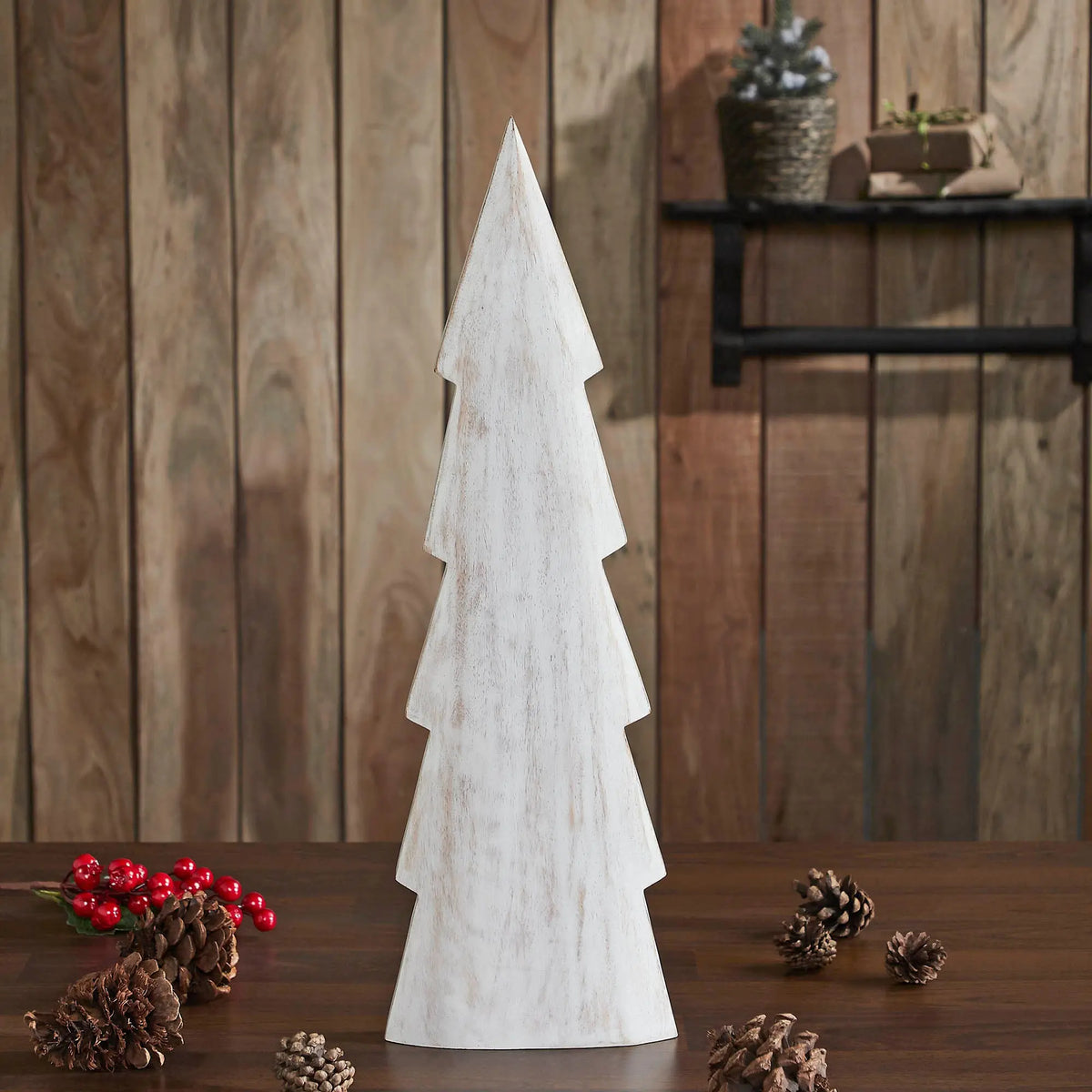 Wooden Christmas tree decoration on a wooden surface with a rustic background