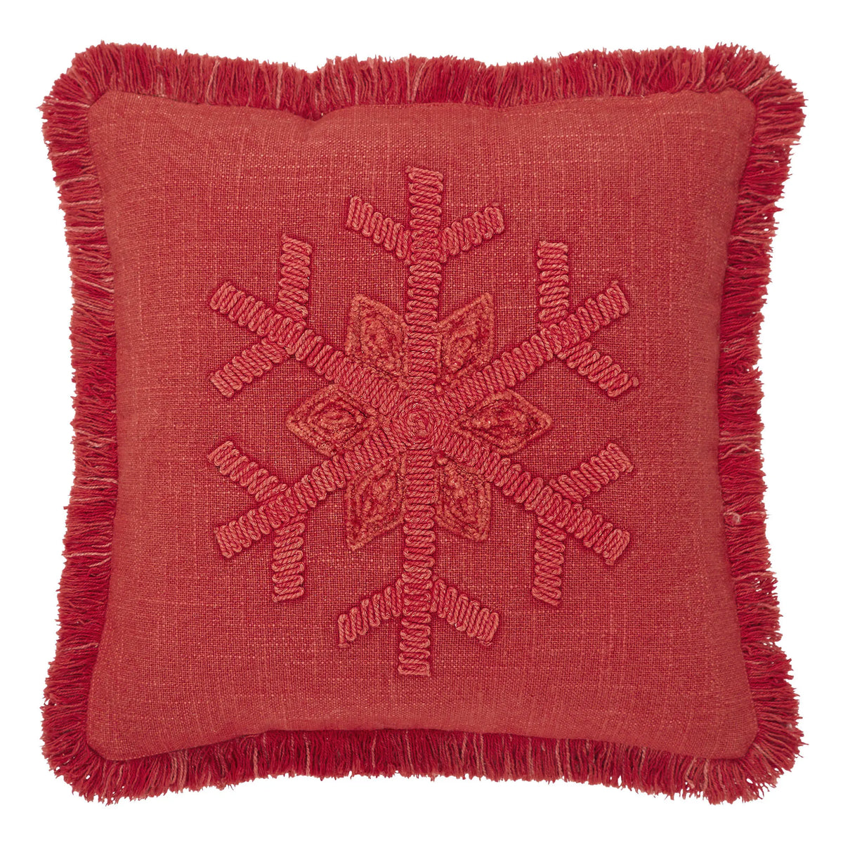 A square red throw pillow with a fringed border and a raised embroidered snowflake design in the center, shown against a plain white background.