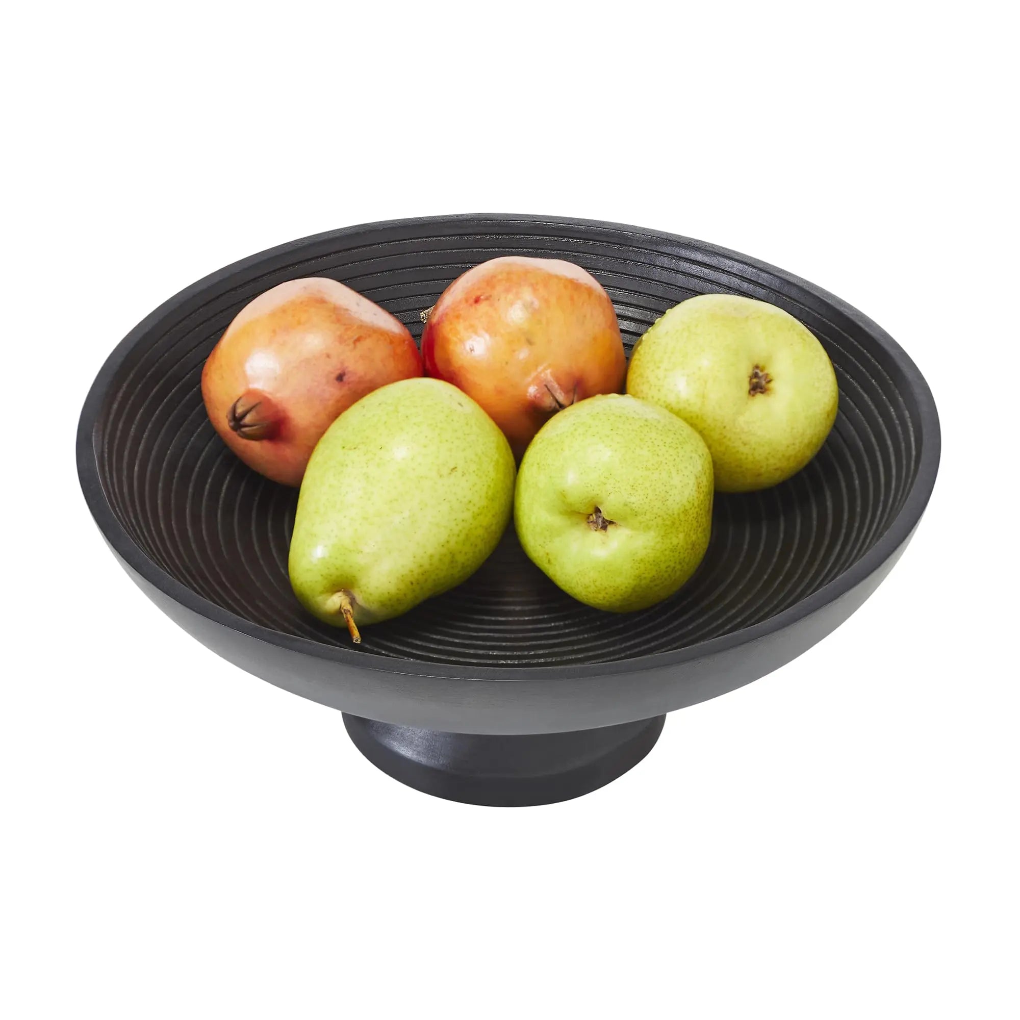 Black textured bowl with pomegranates and green apples on a white background