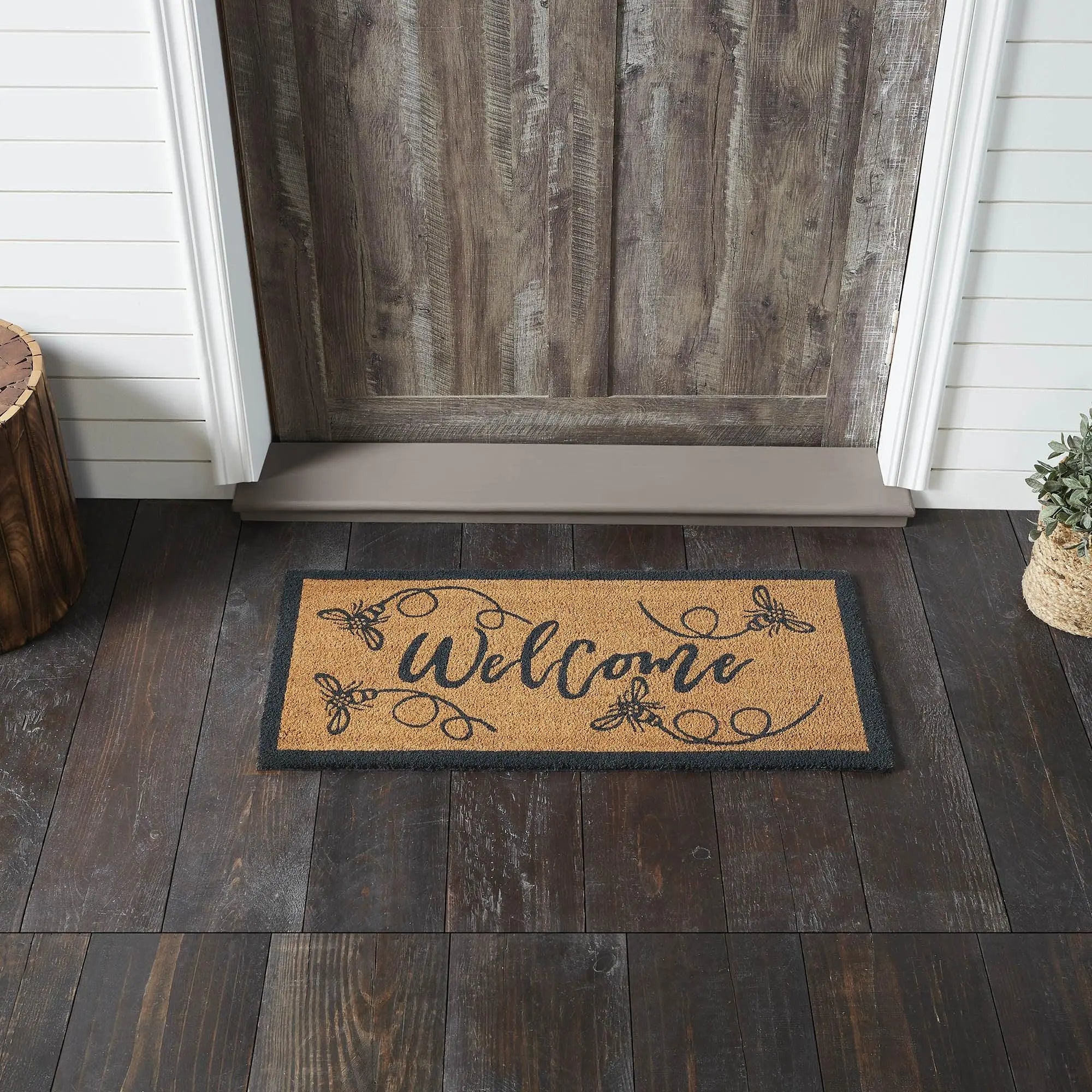 Welcome doormat with bee design, farmhouse entryway decor on dark wood floor