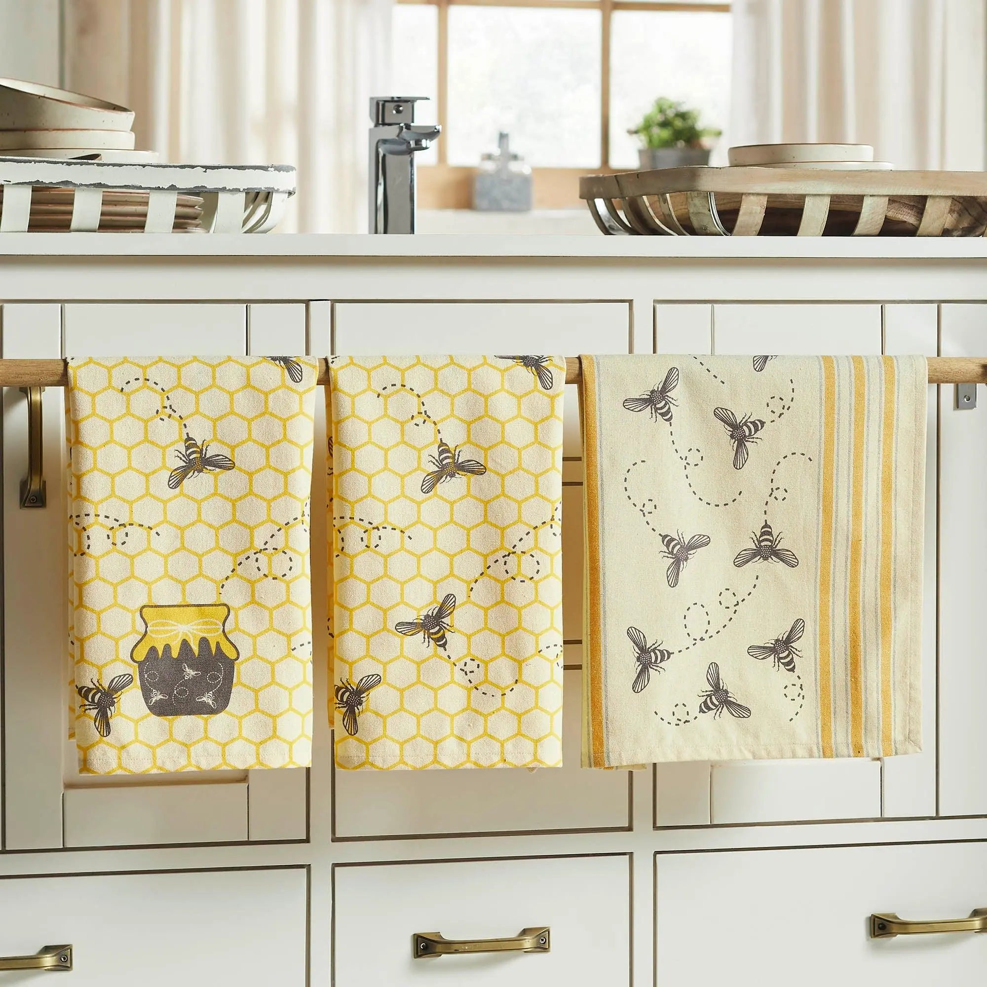 Bee and honeycomb kitchen towels in farmhouse style, perfect for cozy cottage decor