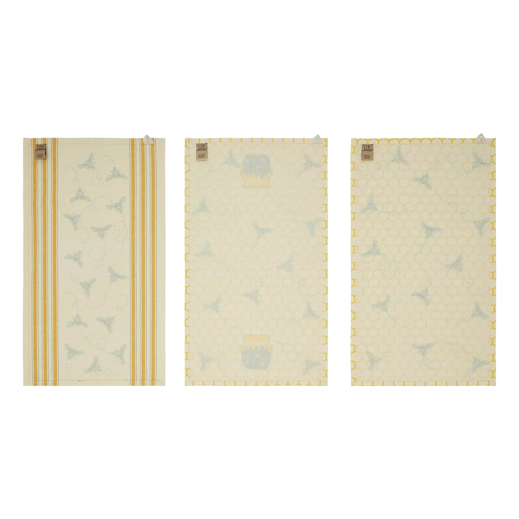 Set of three farmhouse kitchen towels with bee and honeycomb designs, yellow stripes, cozy cottage decor