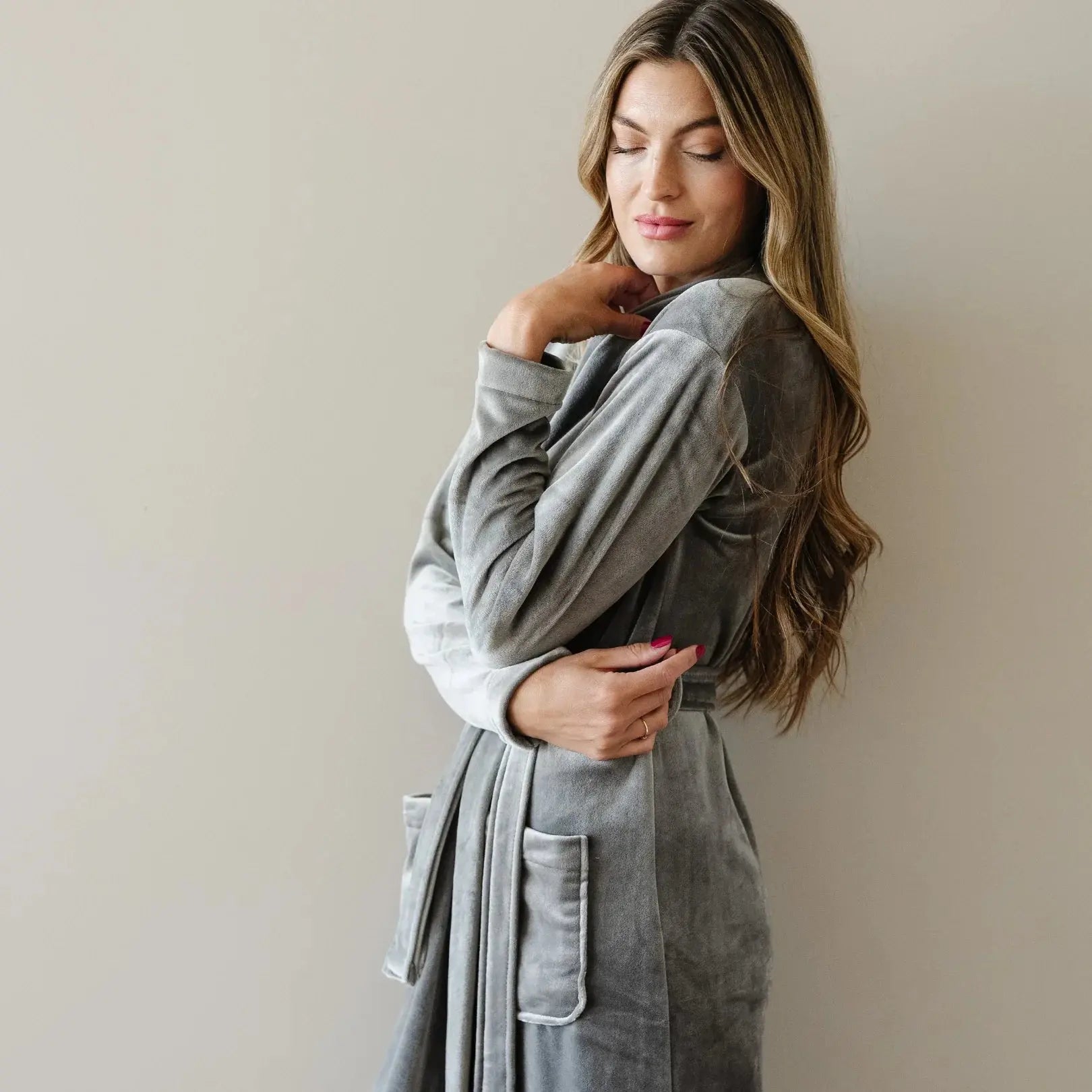 Woman in cozy gray velvet robe, perfect for farmhouse or cottage style bath & relaxation