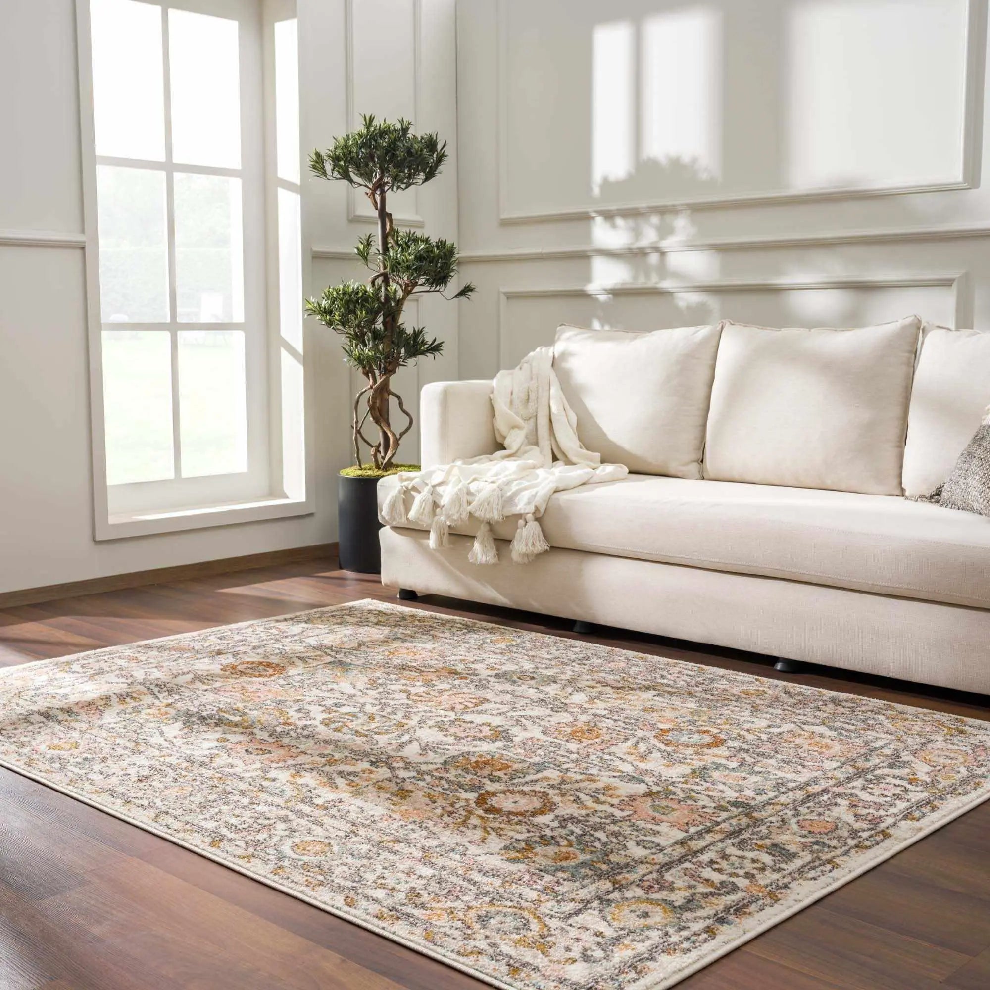 Cozy farmhouse-style area rug with vintage floral pattern in neutral tones, perfect for living room decor