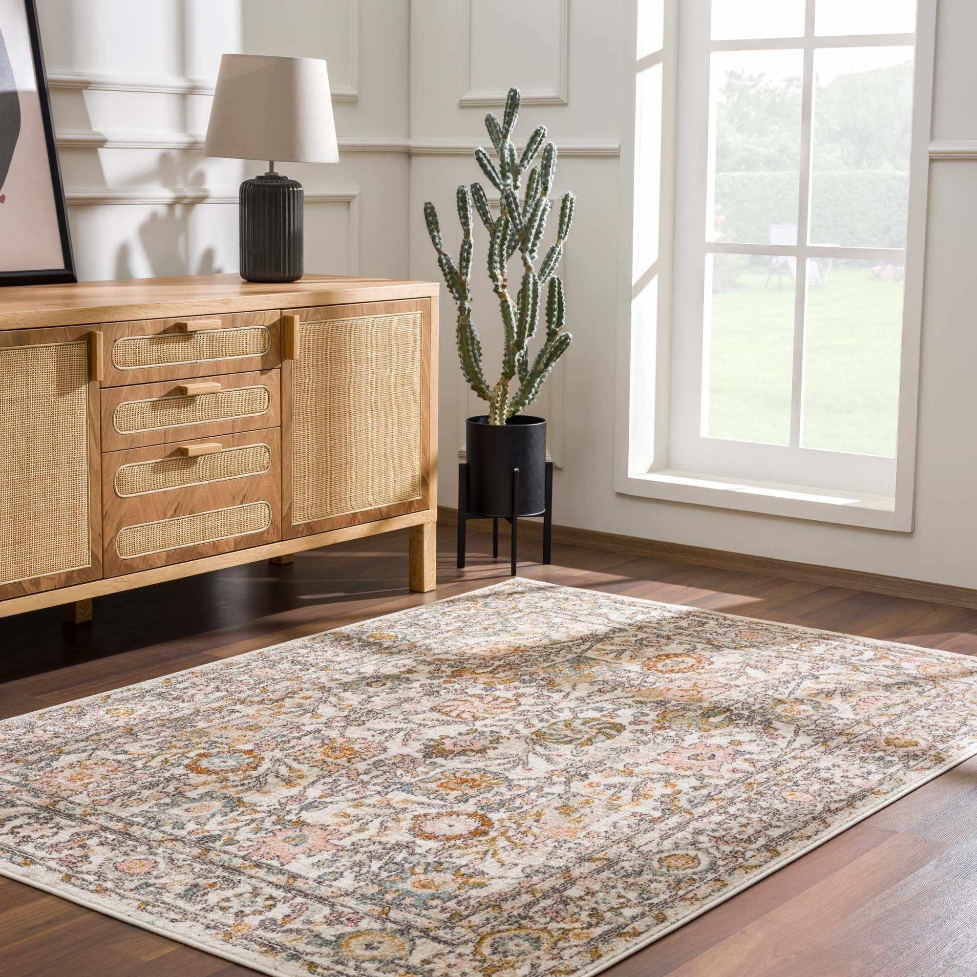 Vintage-style area rug with floral pattern in cozy living room, perfect for farmhouse or cottage decor