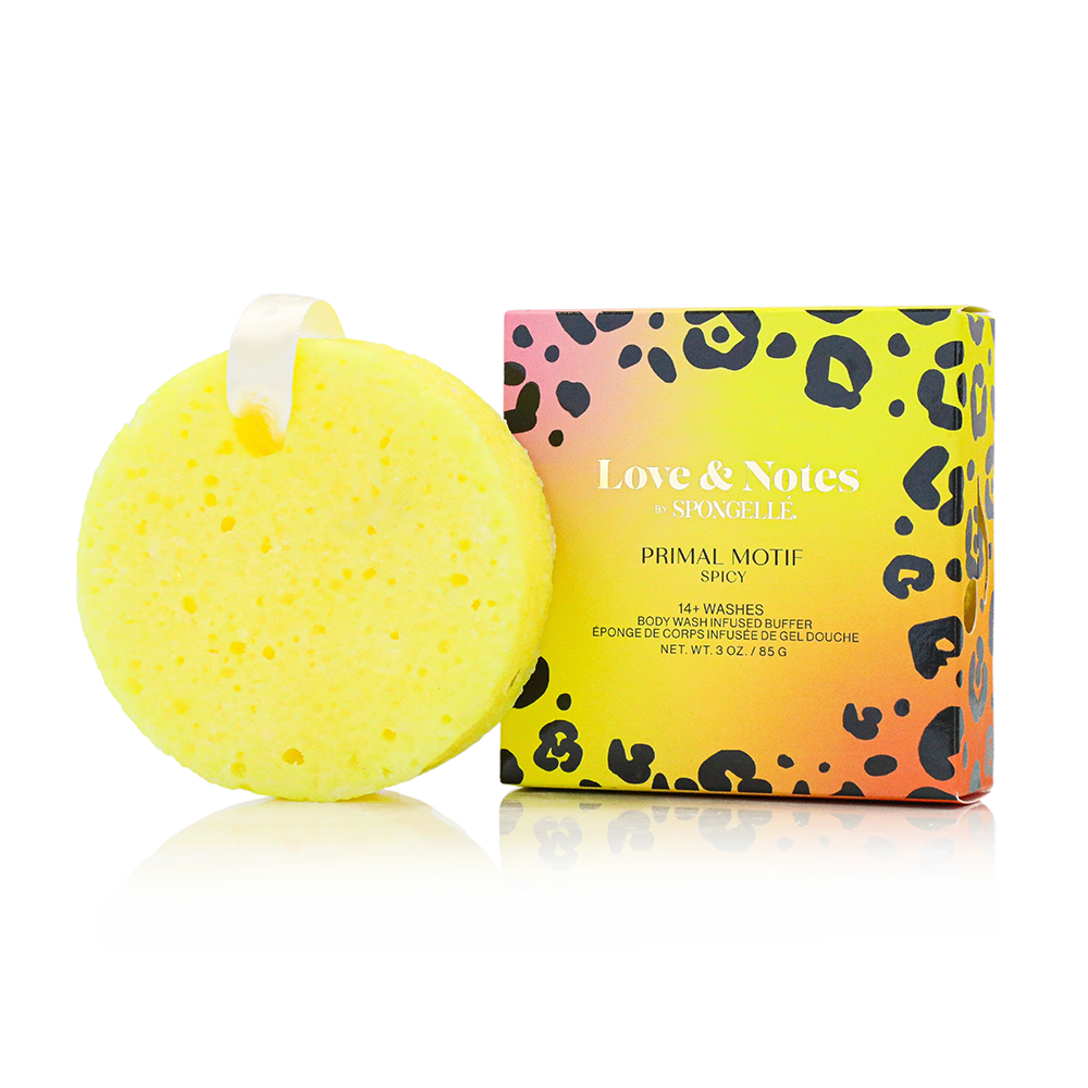Yellow bath sponge with a colorful packaging box on a white background