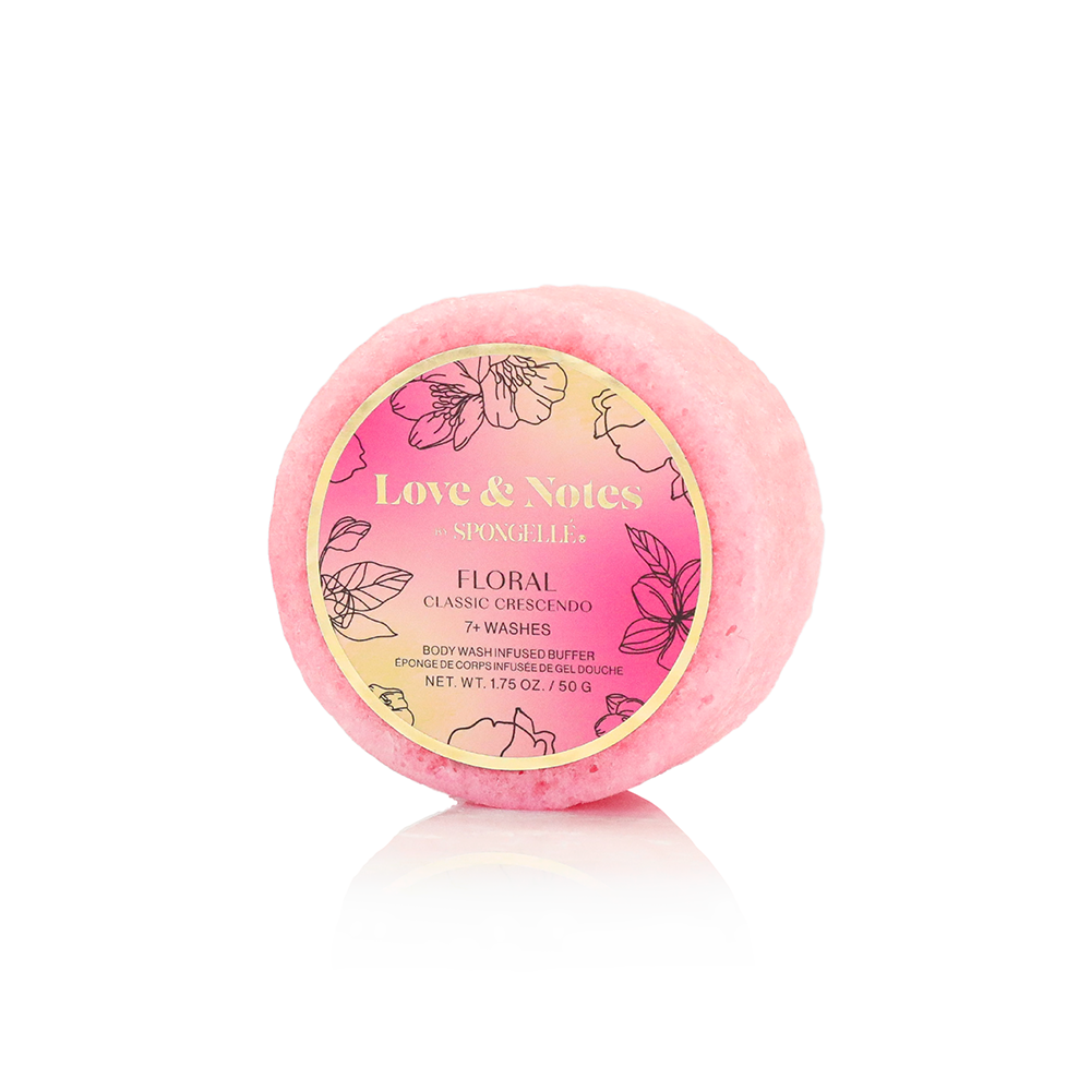 Pink bath bomb with 'Love & Notes' label on a white background