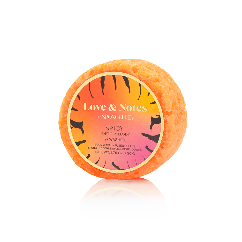 Orange bath bomb with a label on a white background