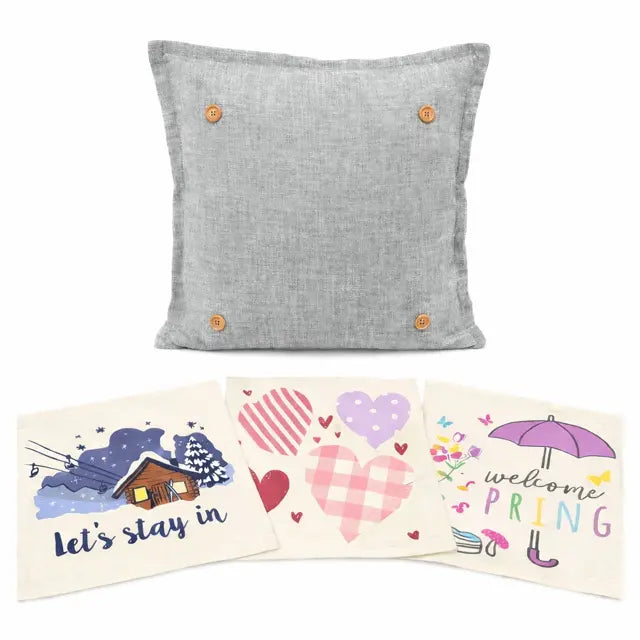 A square light gray linen throw pillow with four wooden buttons, displayed above three cream-colored square cards featuring spring-themed illustrations and text.