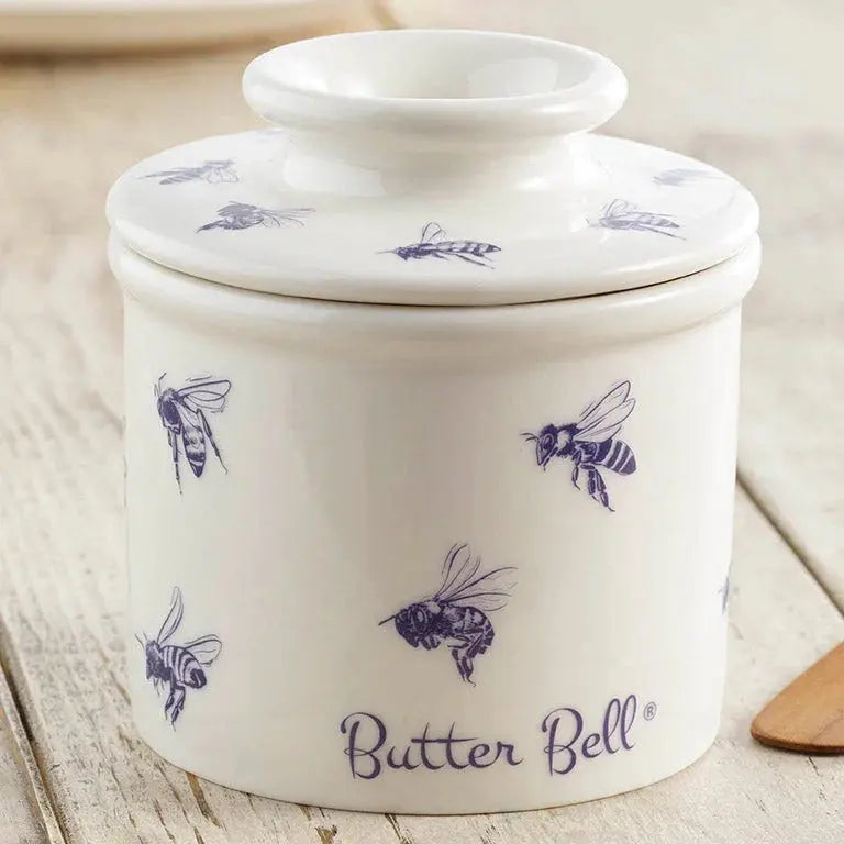 White ceramic butter bell with purple bee design, farmhouse kitchen decor