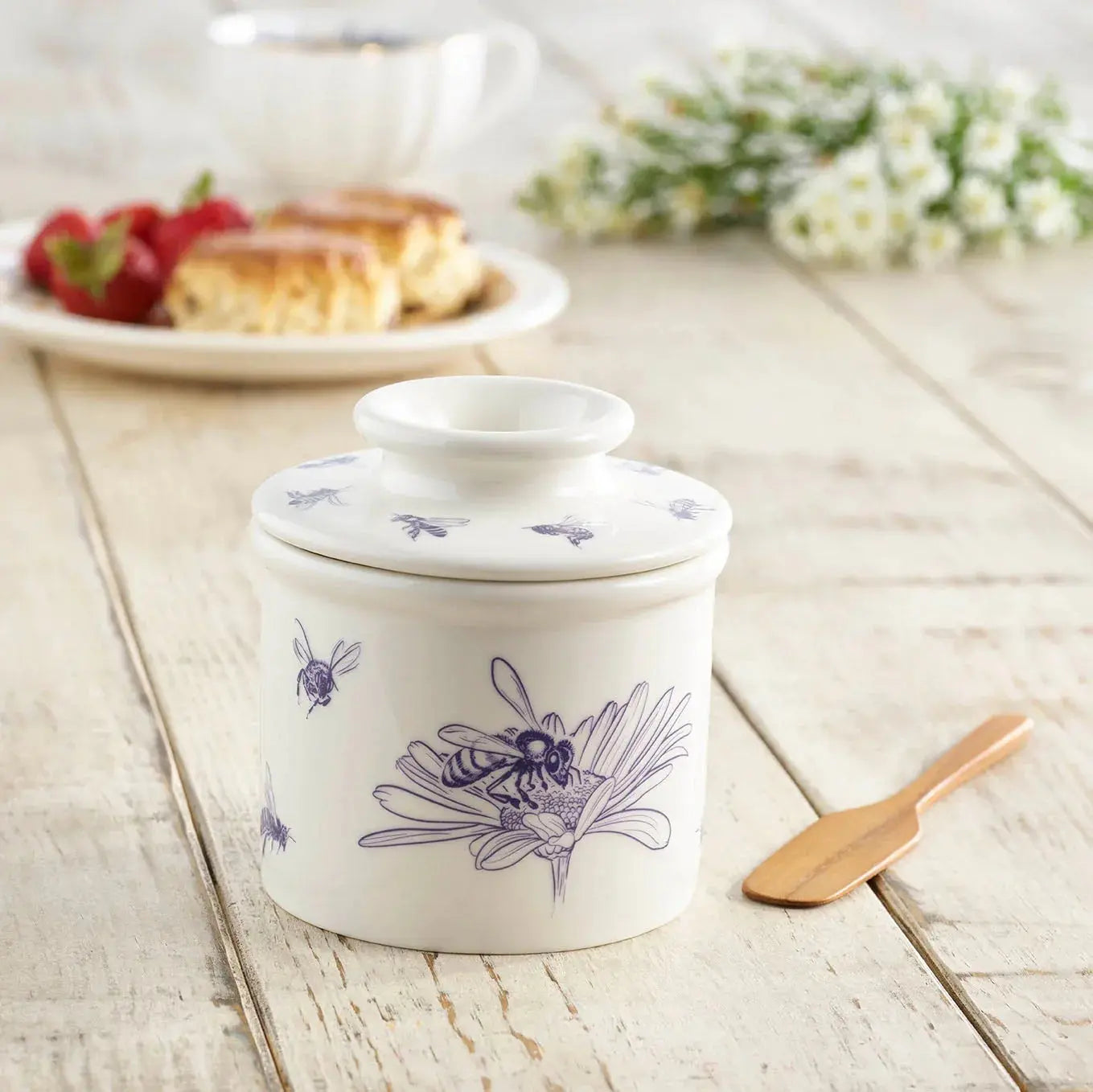 White ceramic honey pot with purple bee and flower design, farmhouse kitchen decor