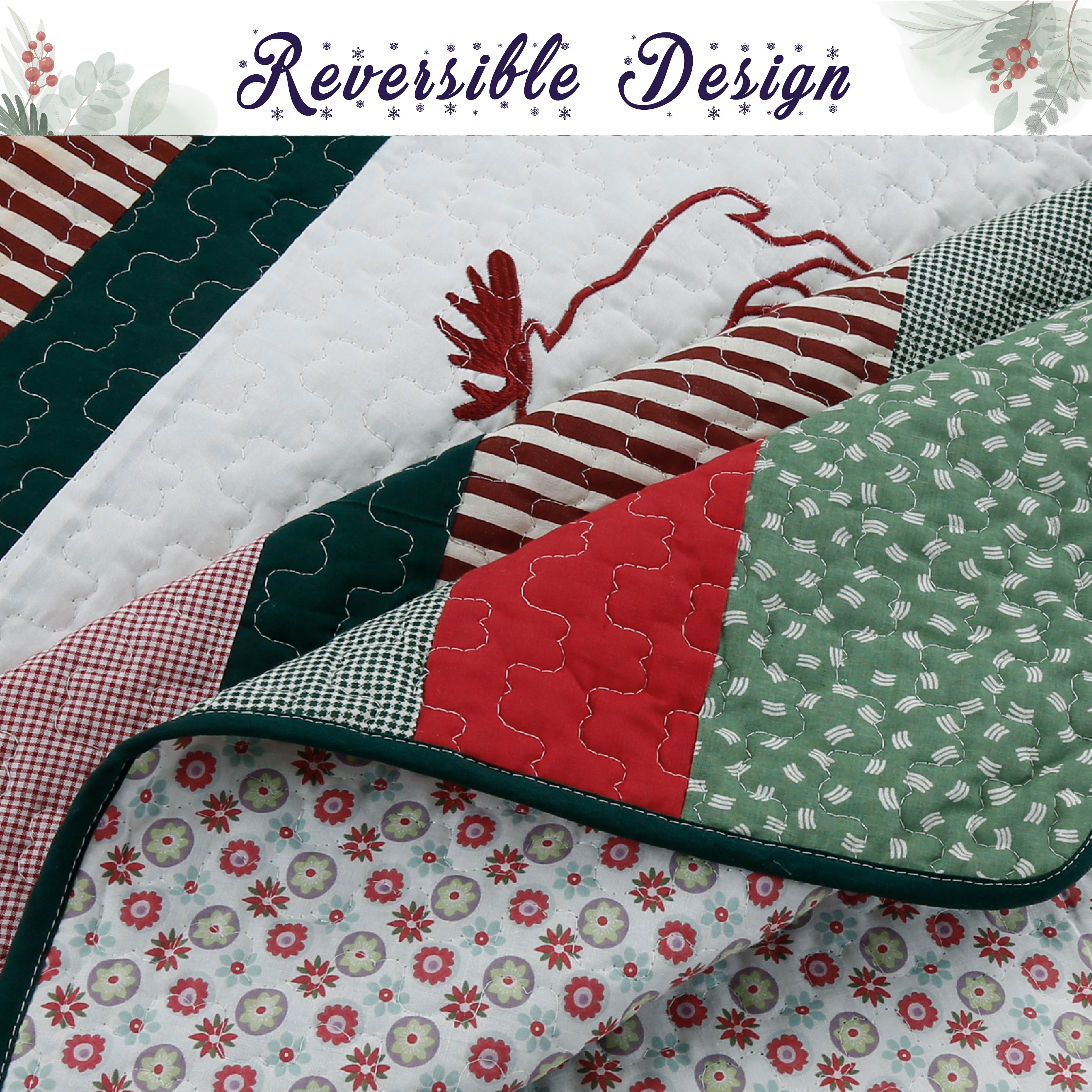 A folded quilted patchwork blanket or quilt shown close up, with visible stitching and multiple fabric panels in red, green, white, and gingham. A banner at the top reads 'Reversible Design' with a floral motif.