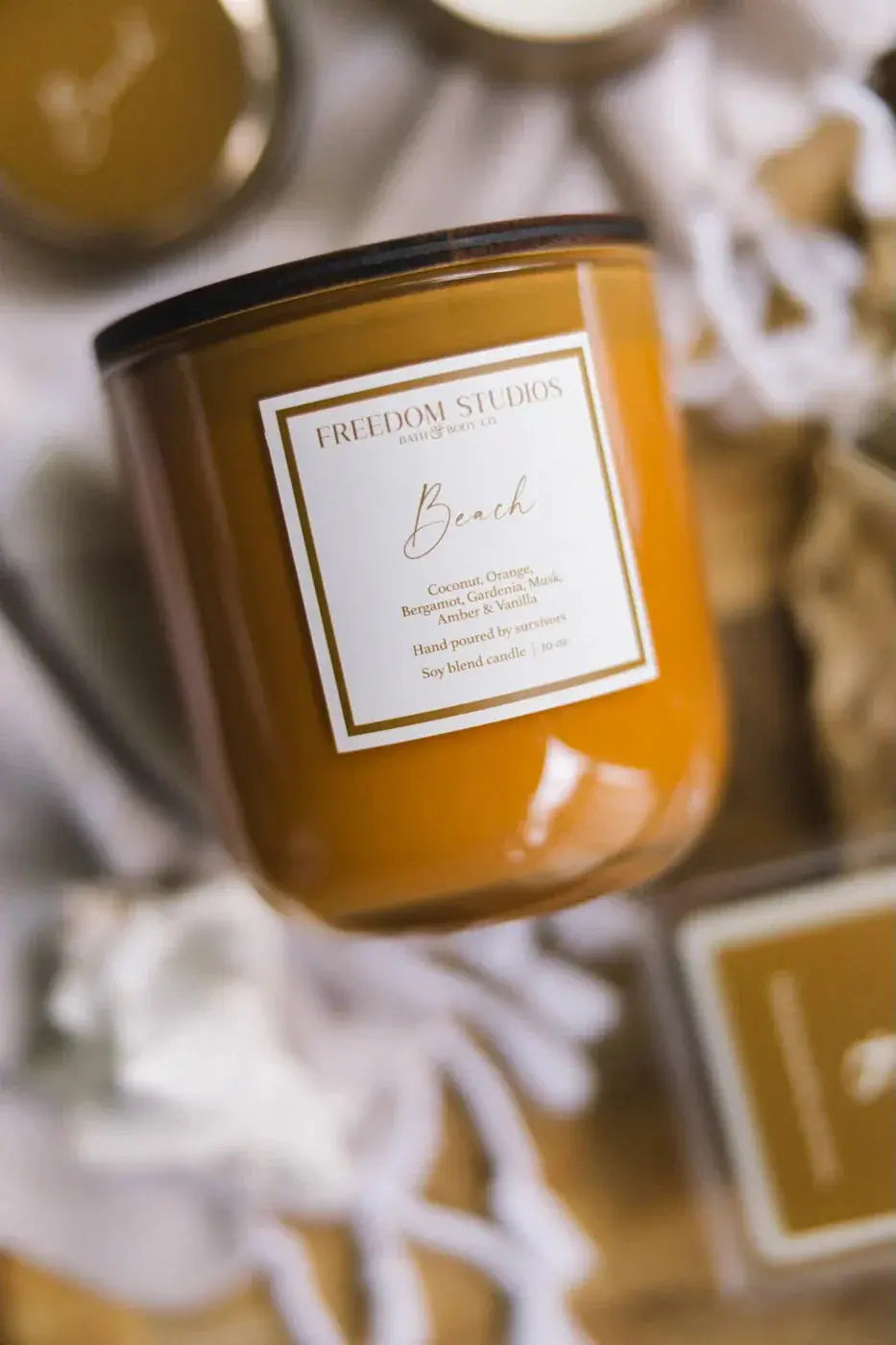 Beach scented soy candle in amber glass, cozy farmhouse decor with coconut orange fragrance