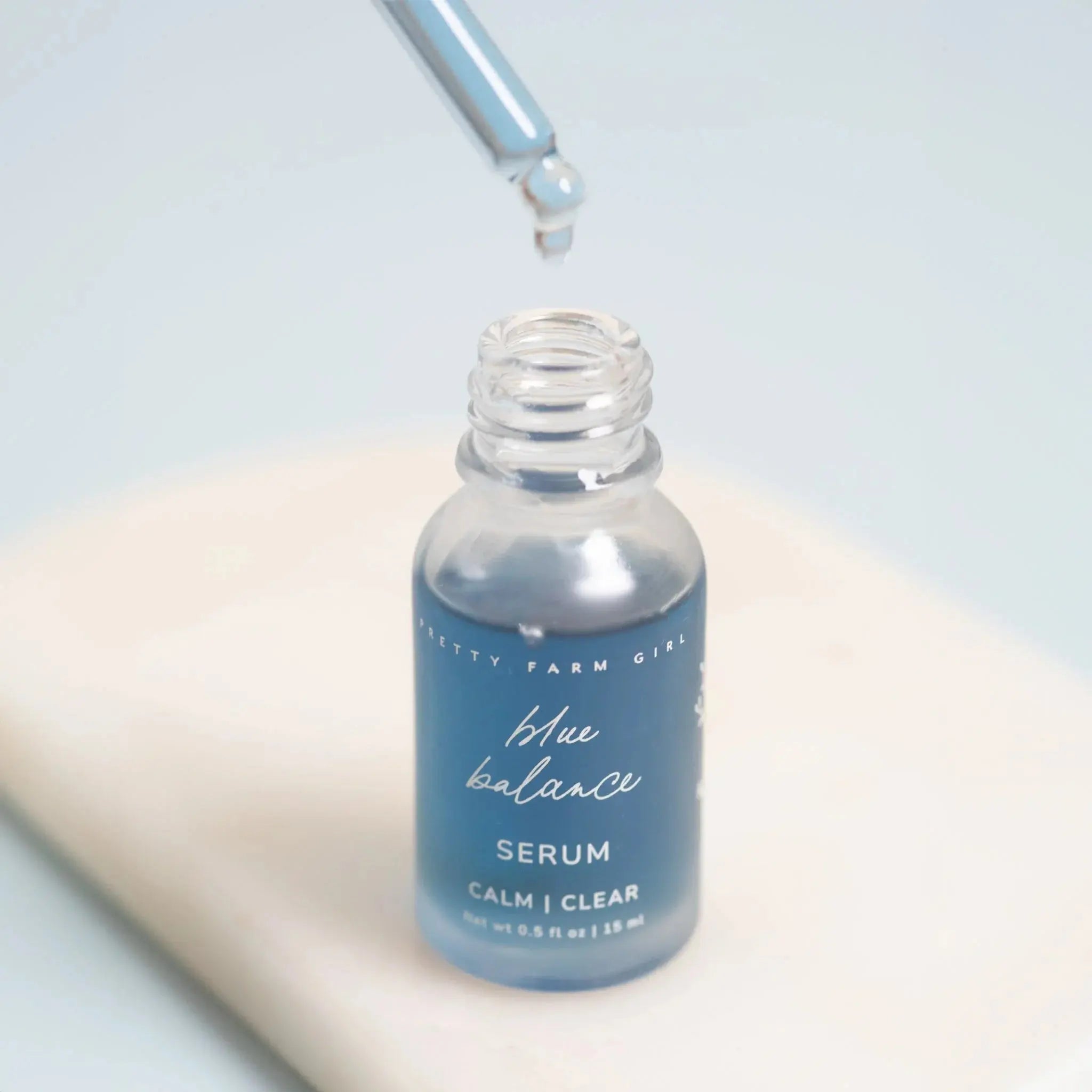 Blue Balance Serum bottle with dropper, calm clear skincare for cozy home wellness
